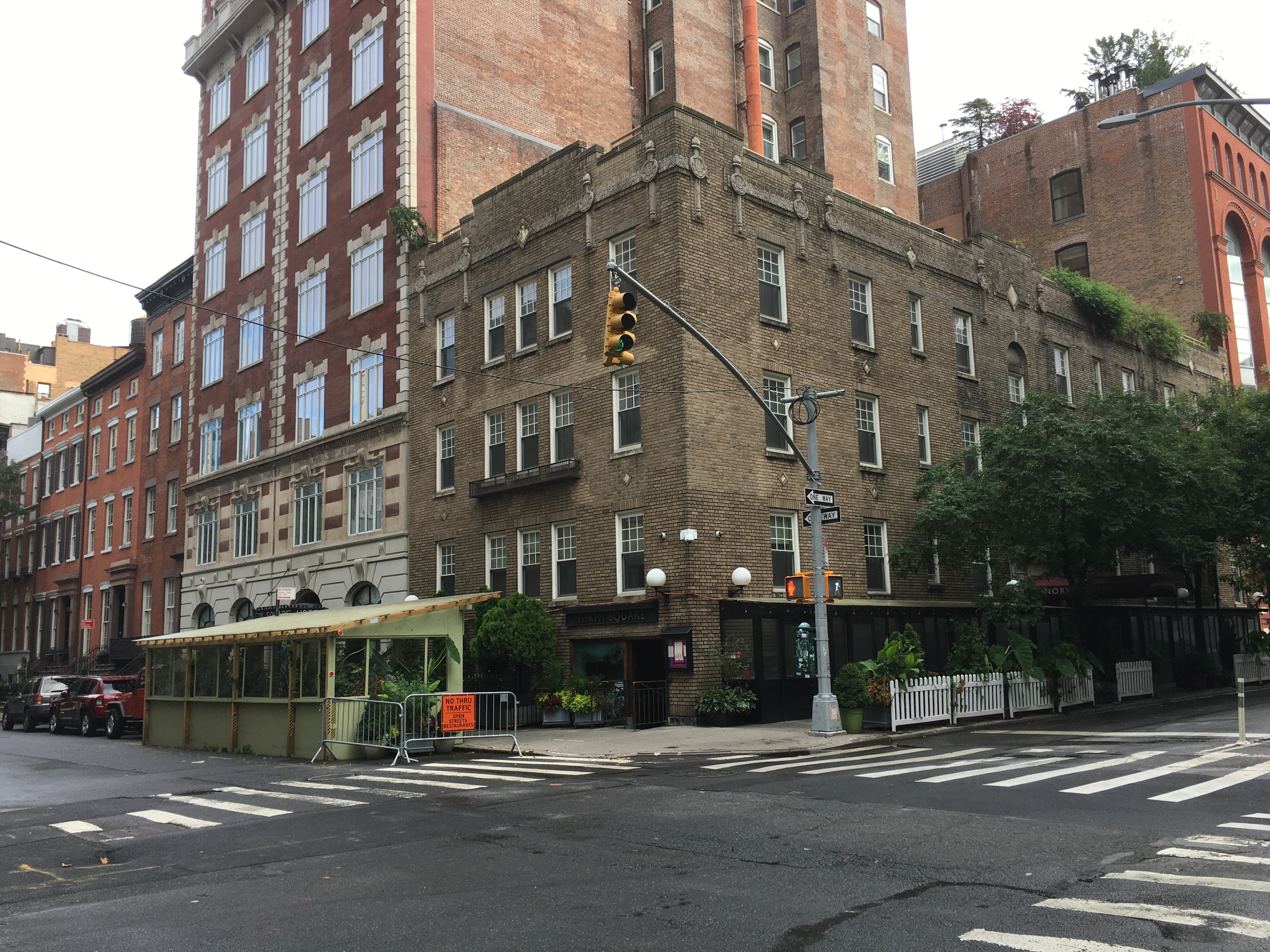 Washington Square Hotel with parklets on two sides for serving during COVID-19 pandemic