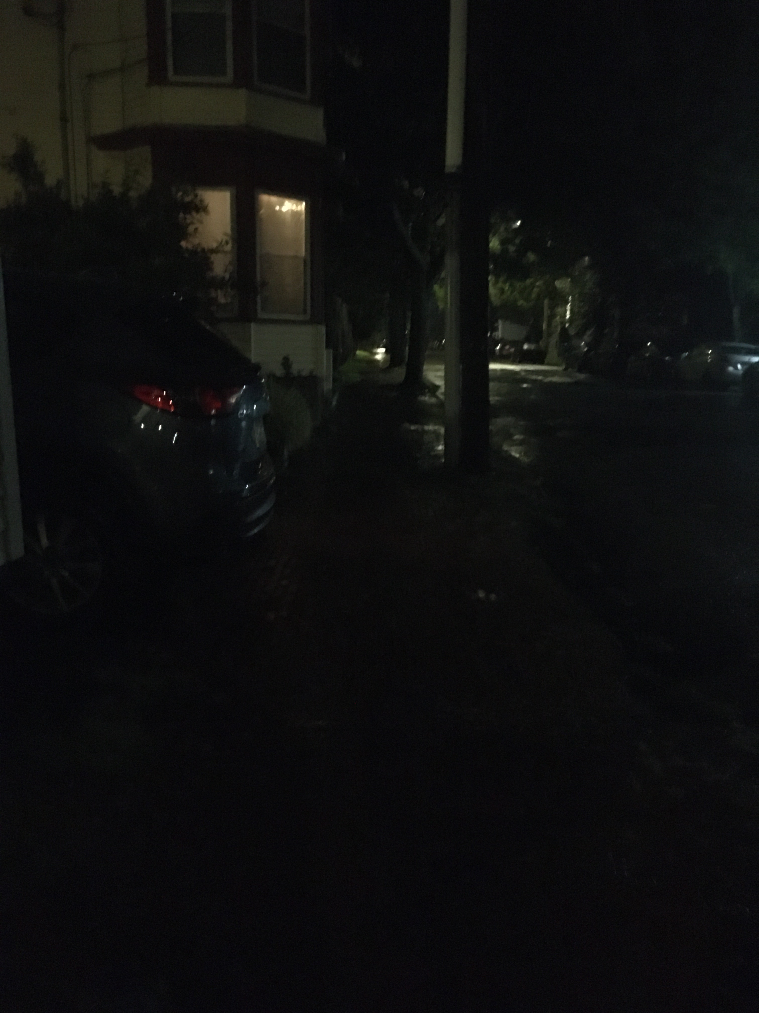 Night image of dimly lit windows - cozy home view