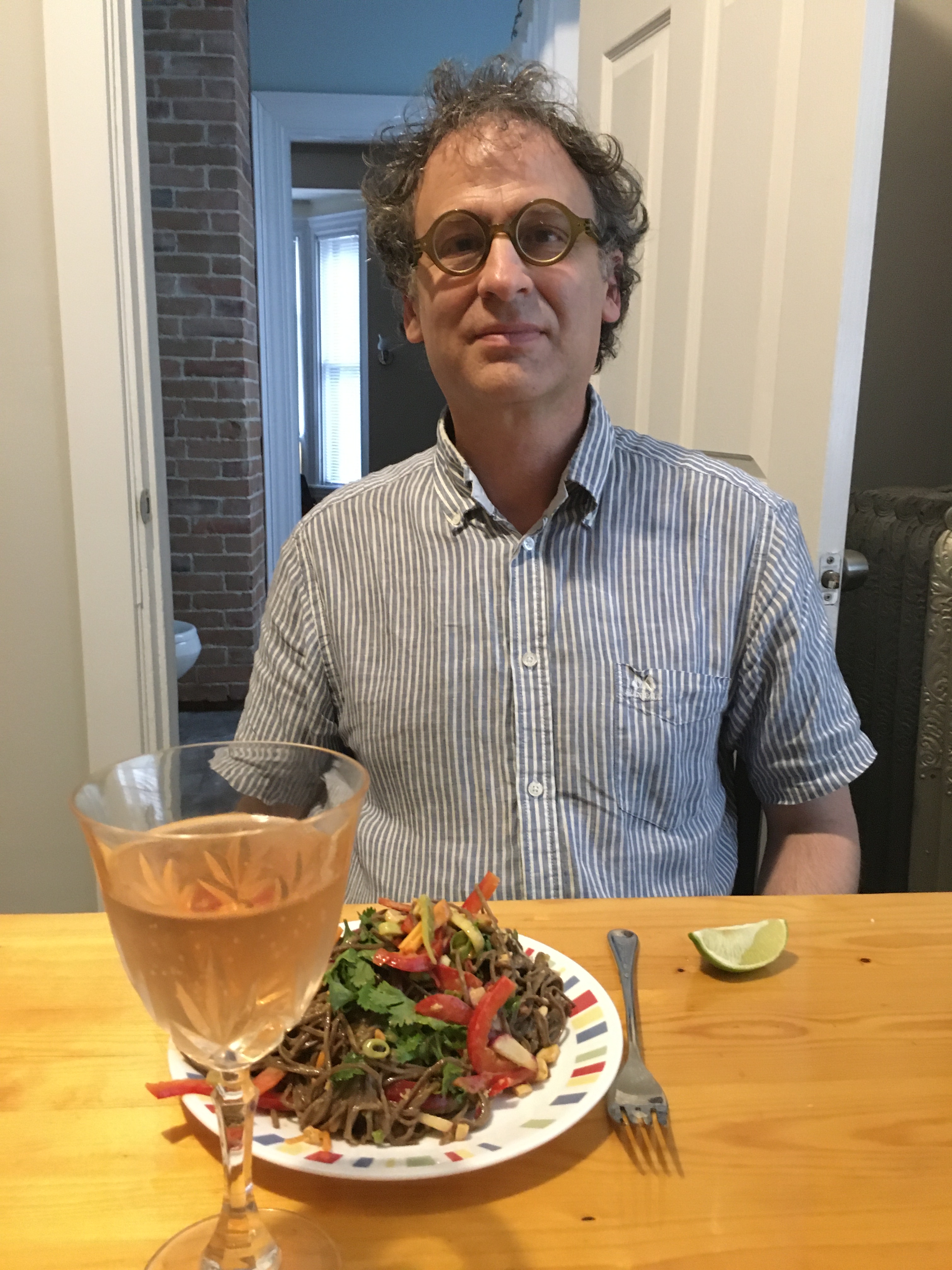 Man with glass of rose and dinner
