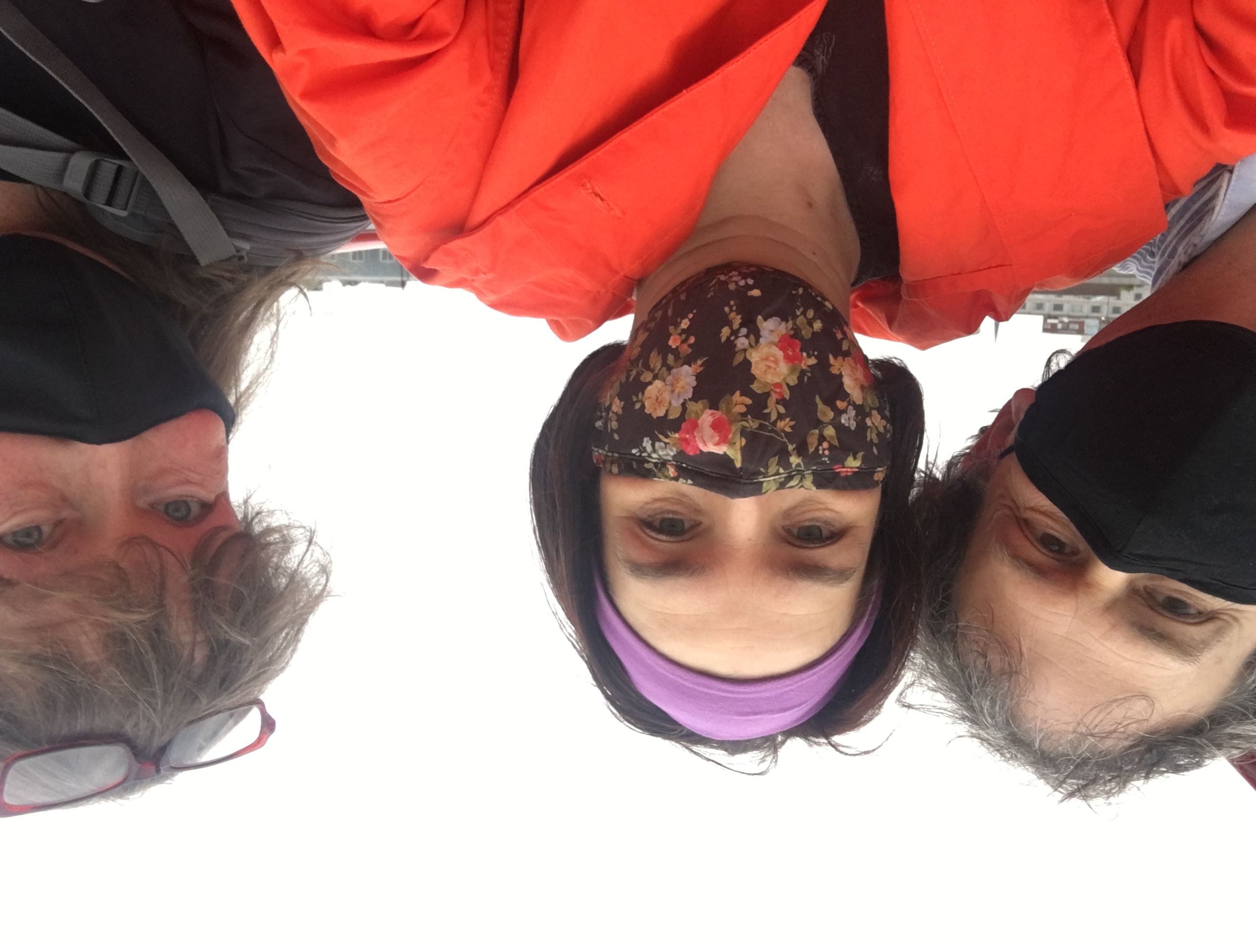 three masked individuals in a selfie