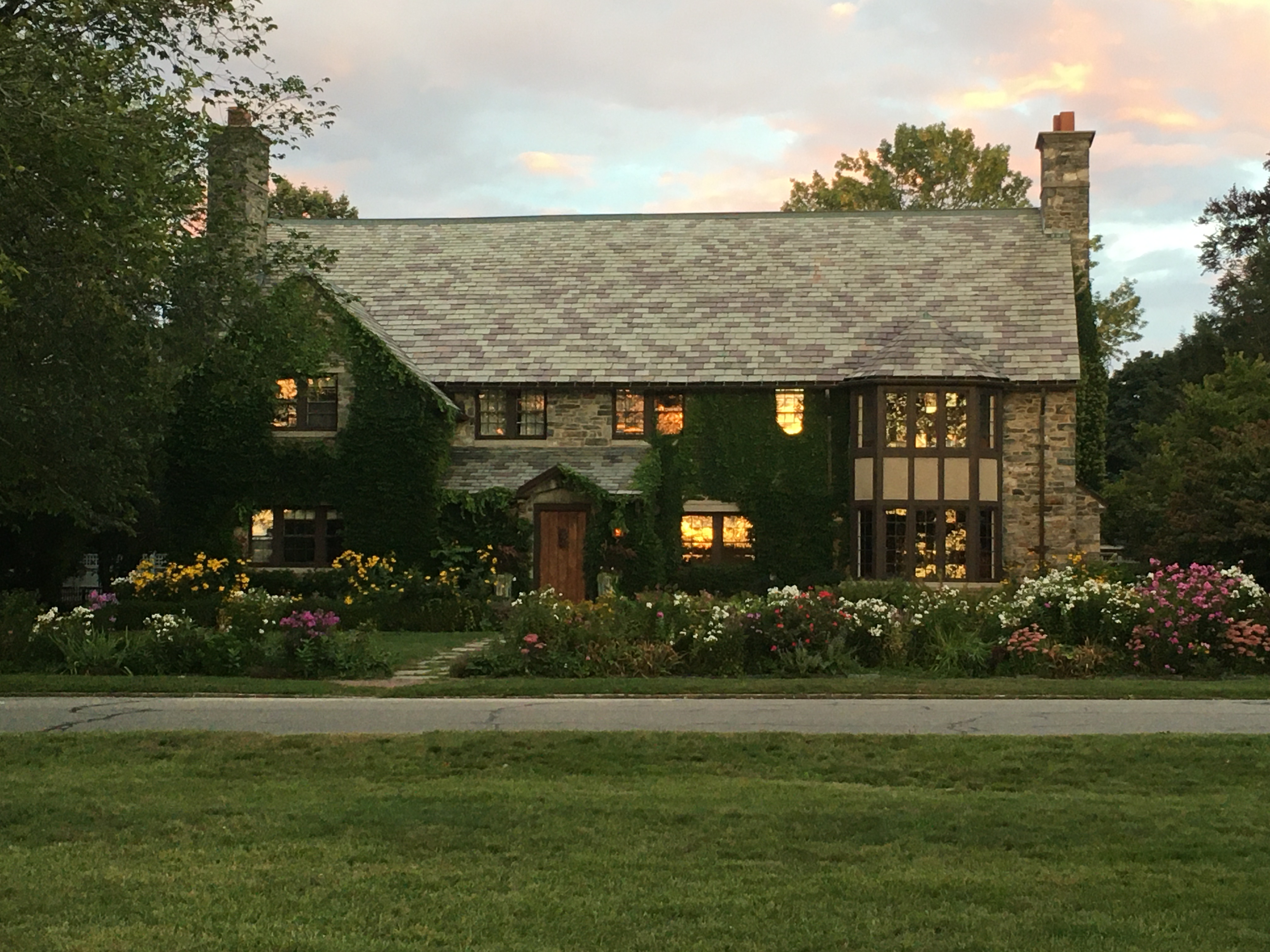 House on the Western Prom with windows reflecting the sunset