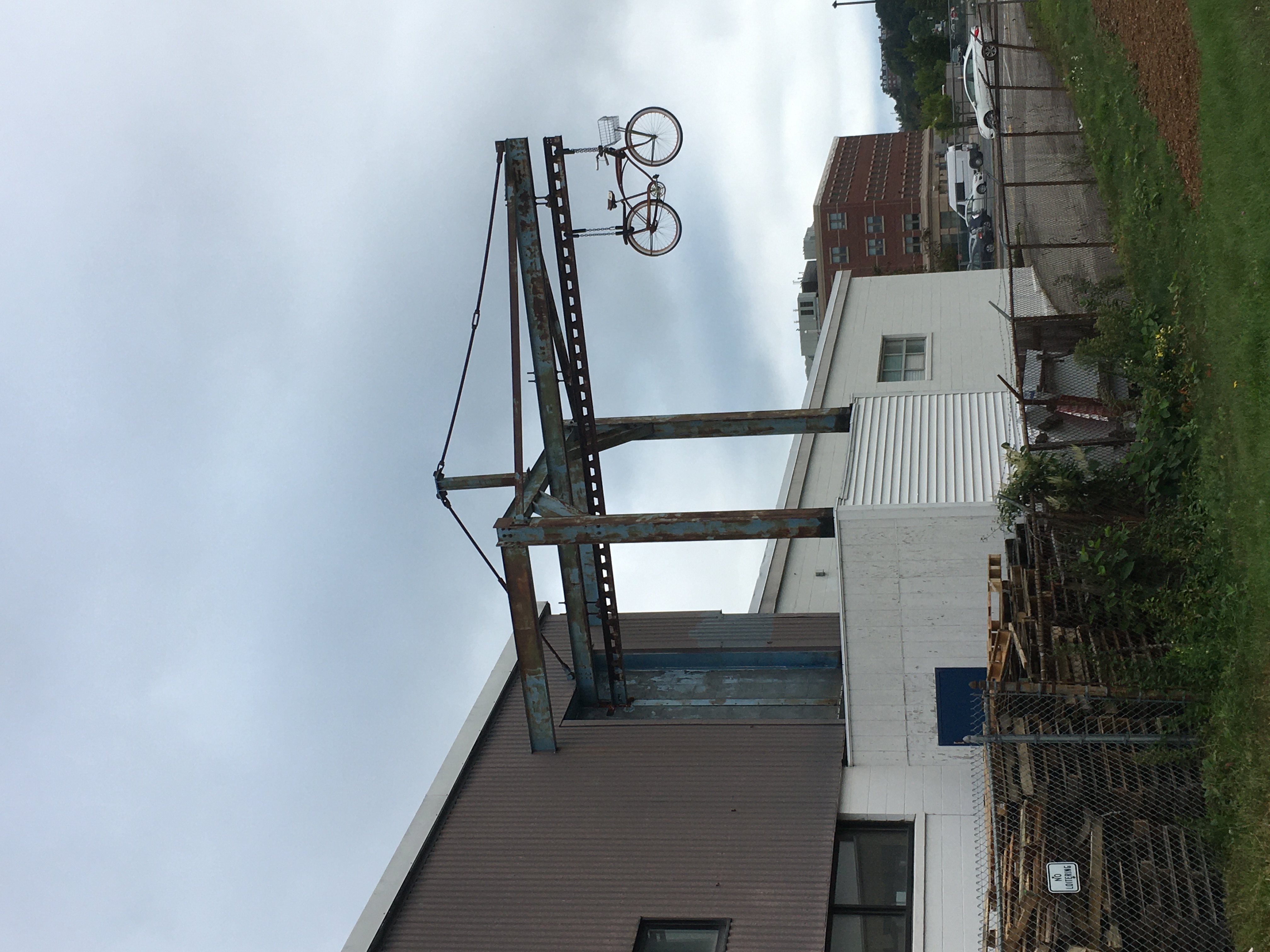 bicycle suspended way in the air off of an iron bar