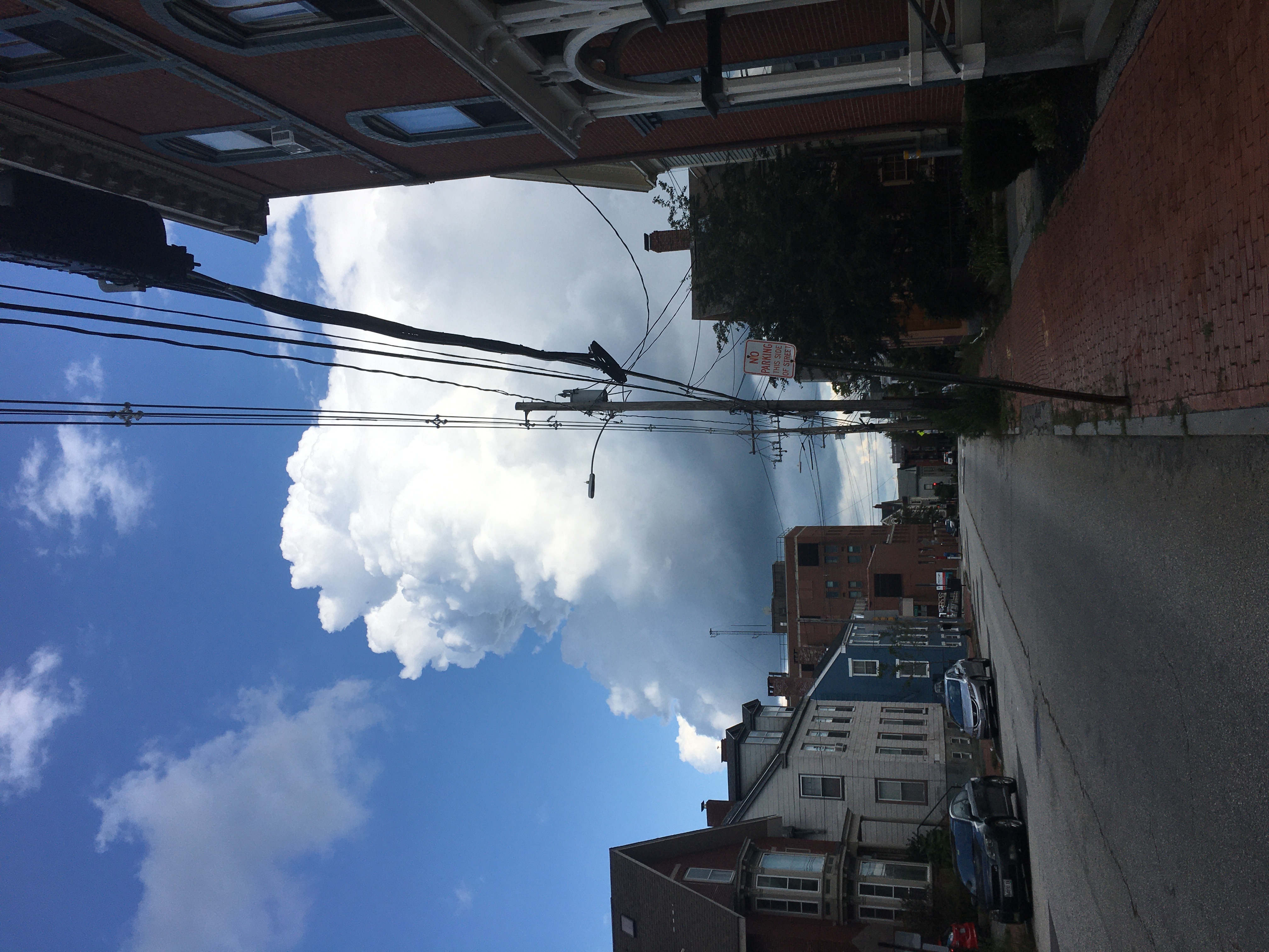 Street in Portland Maine with cumulous clouds