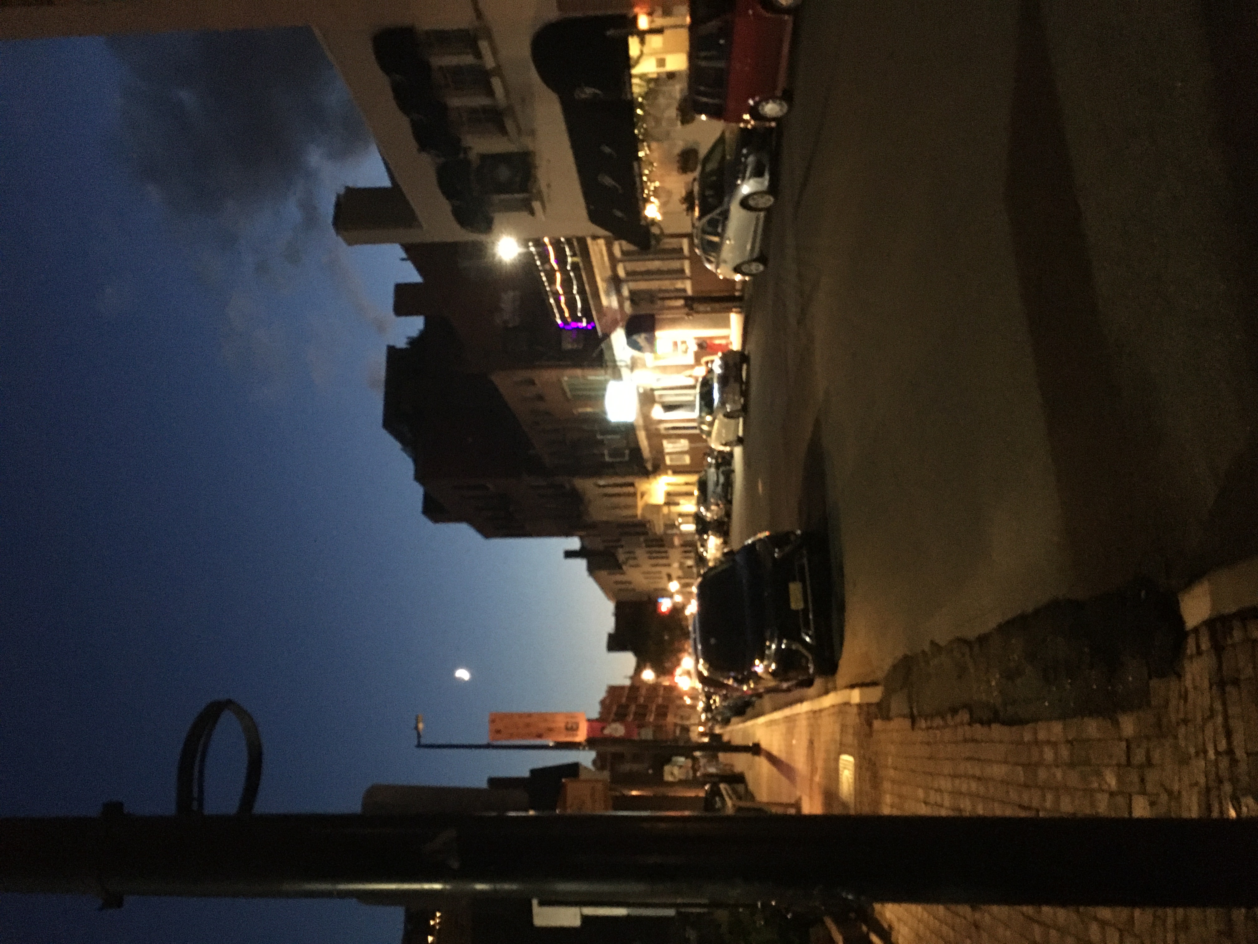 city street with blurry crescent moom