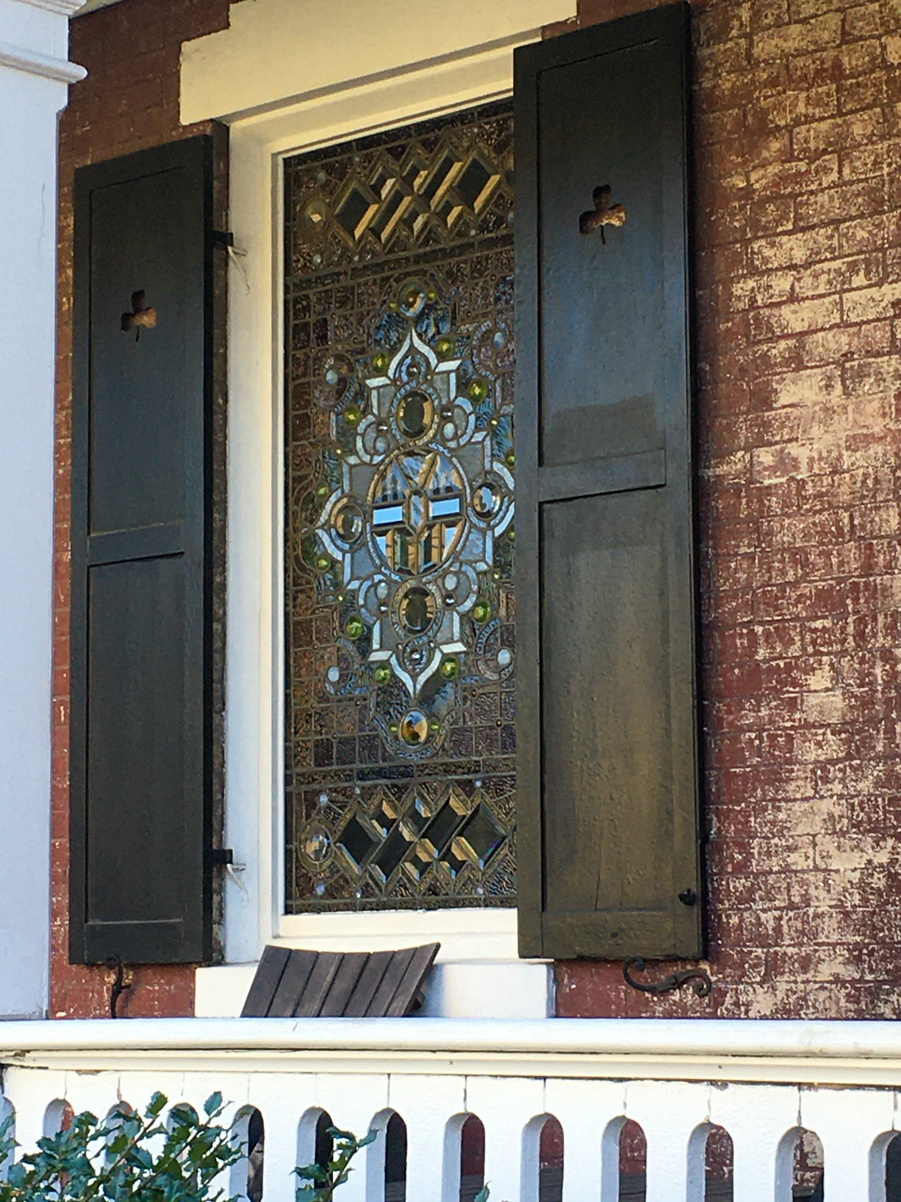 beautiful stained glass window in a brick home