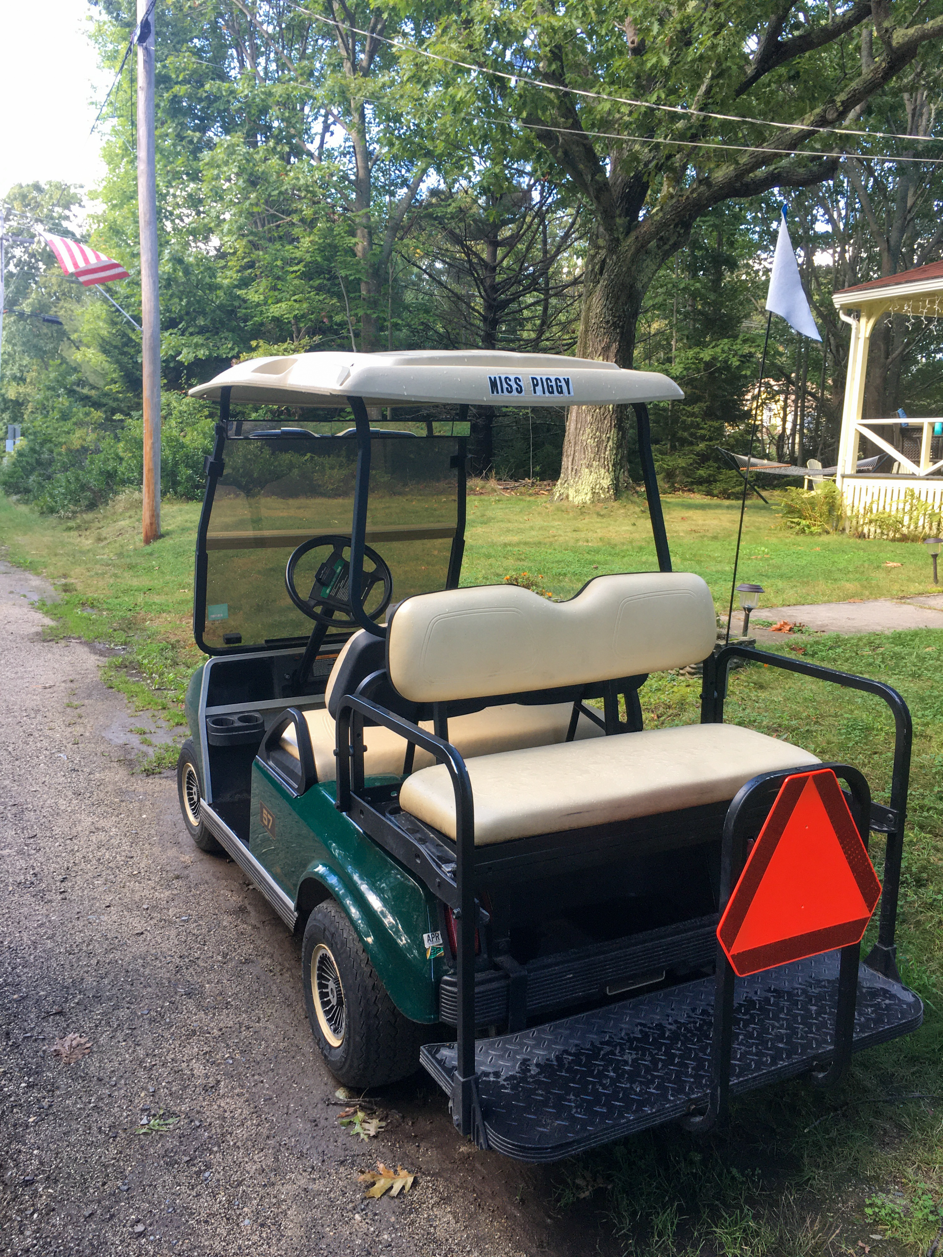 golf cart with Miss Piggy on the back