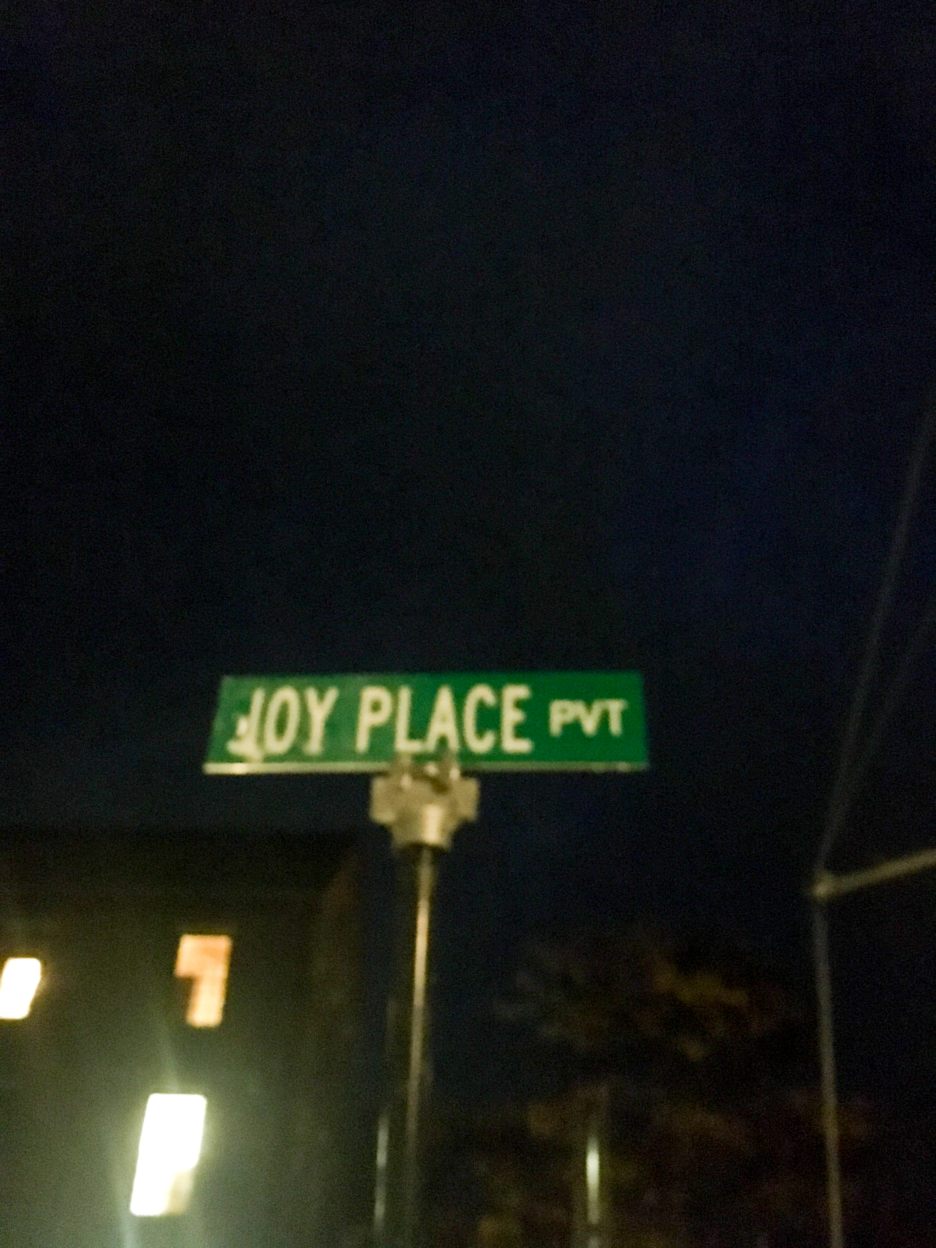 street sign that reads joy place private