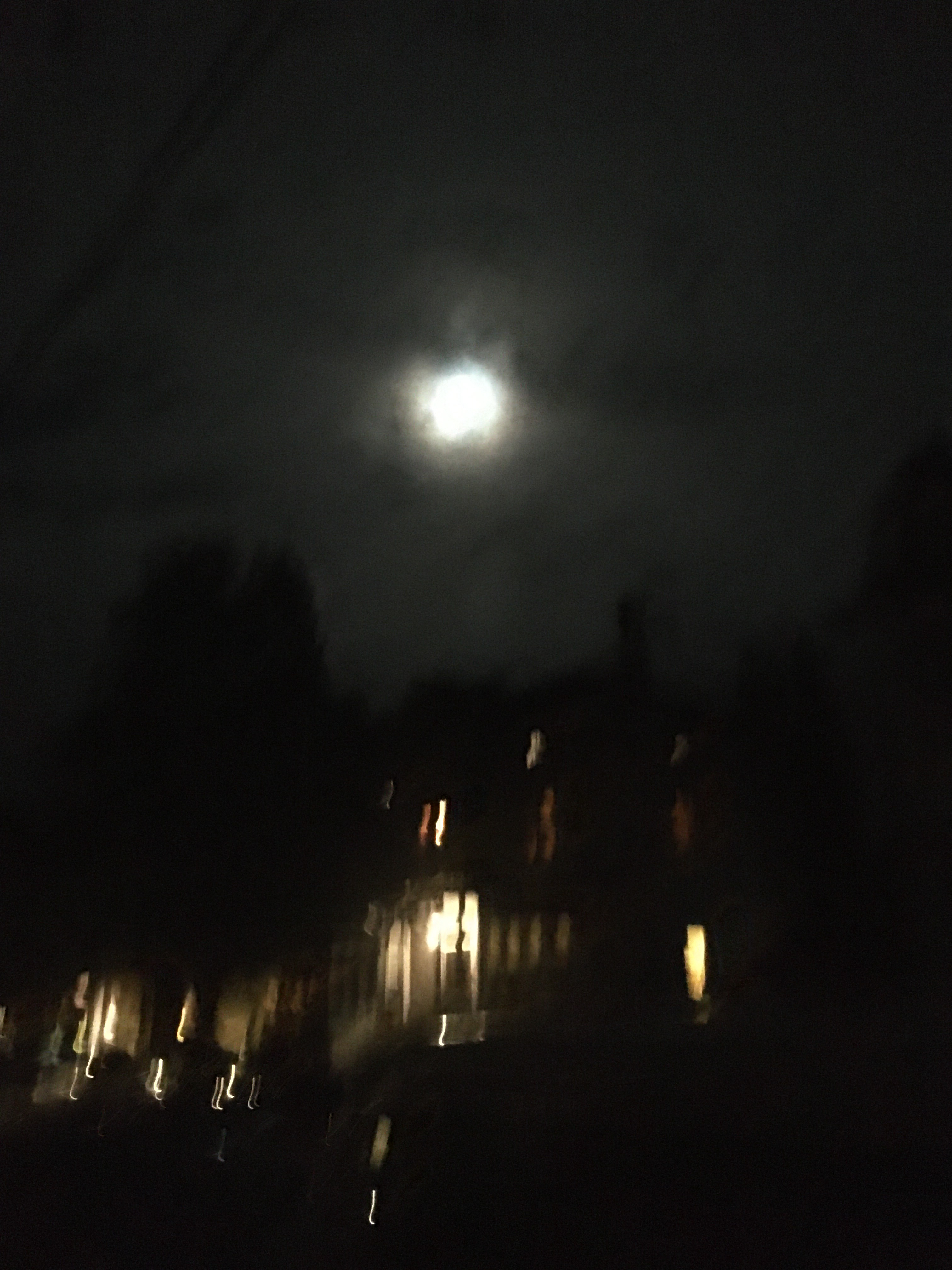 moon with blurry lights below