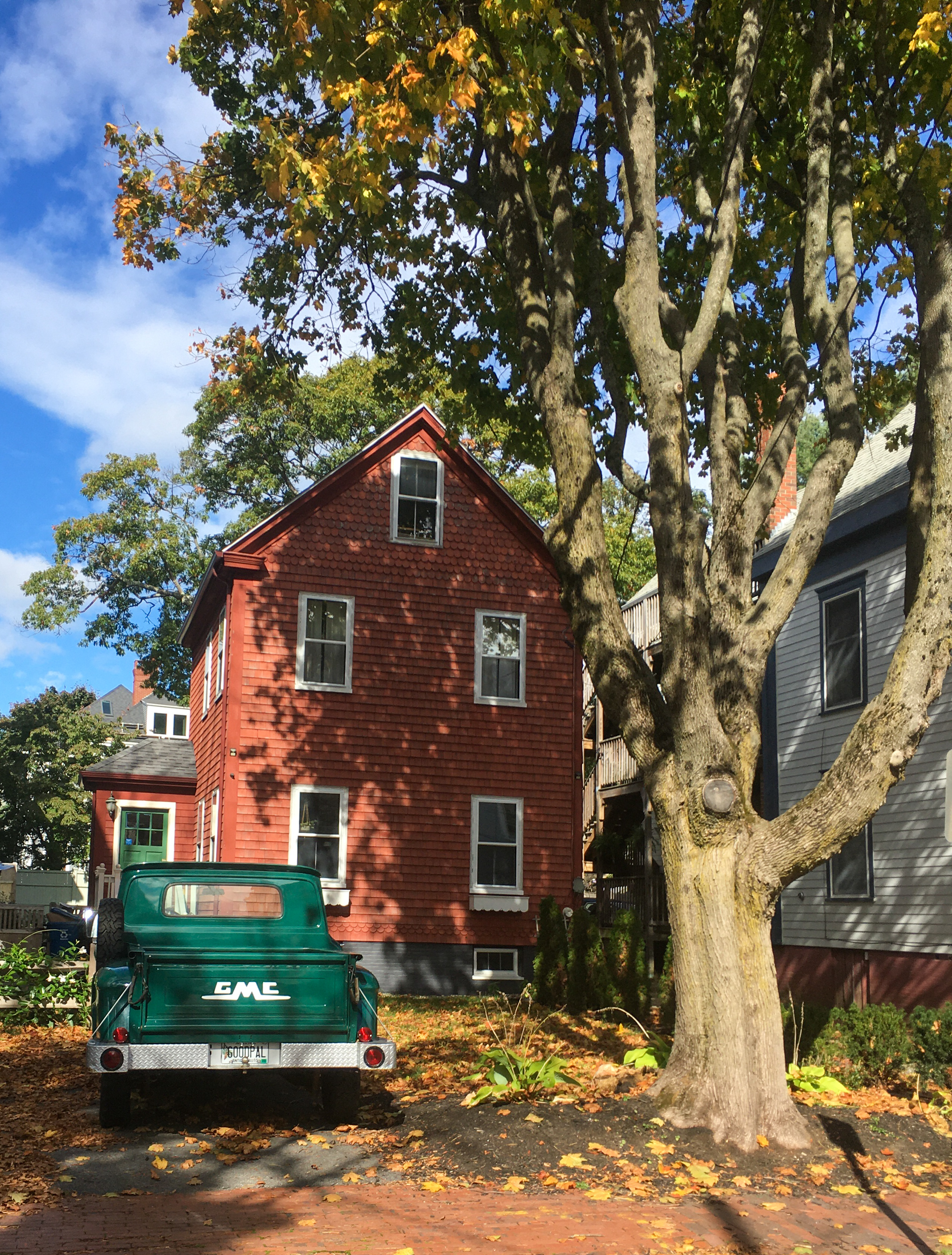 red house with a green GMC truck on Spruce St.