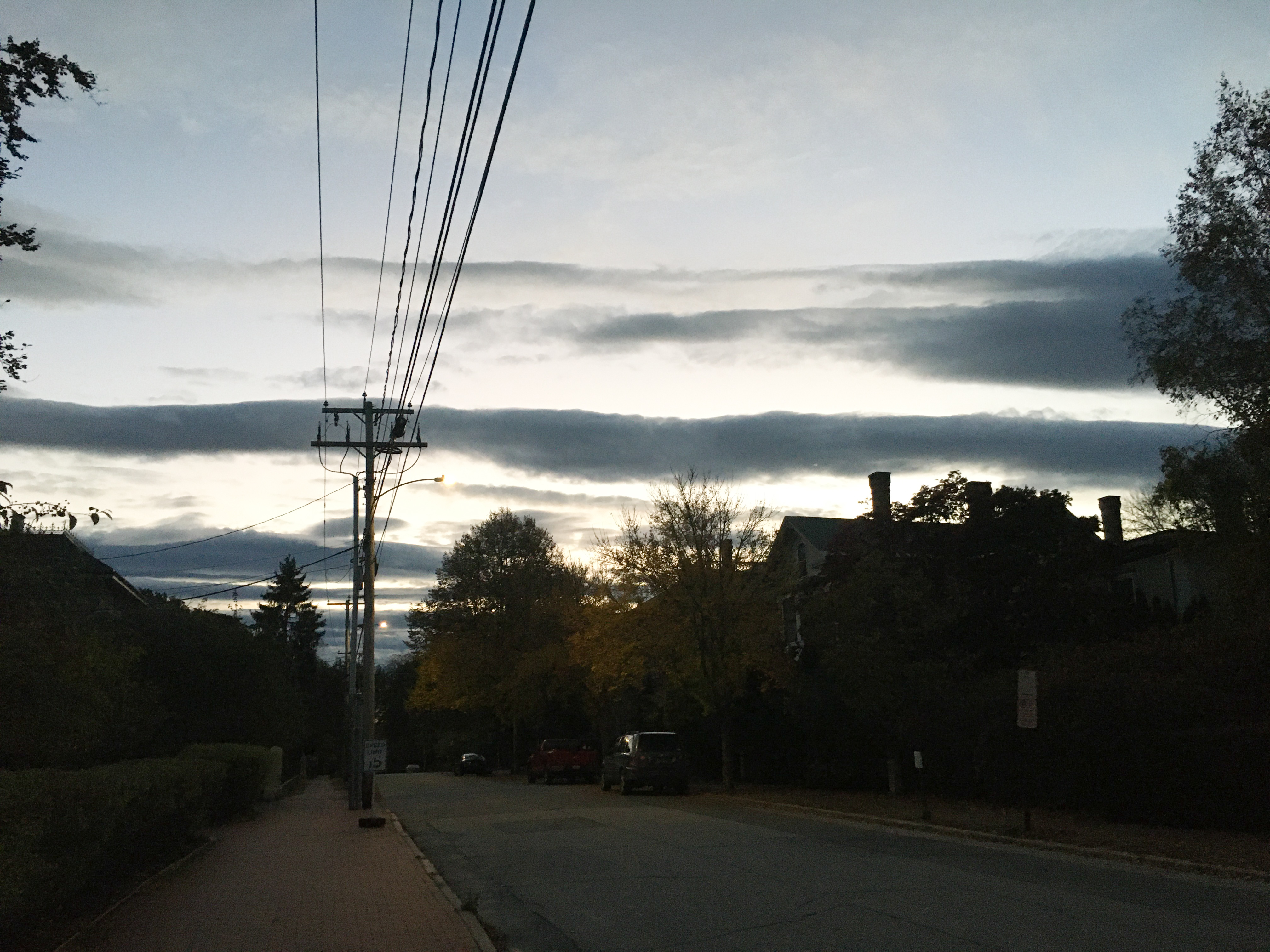 view of clouds with wires cutting through them from top to bottom
