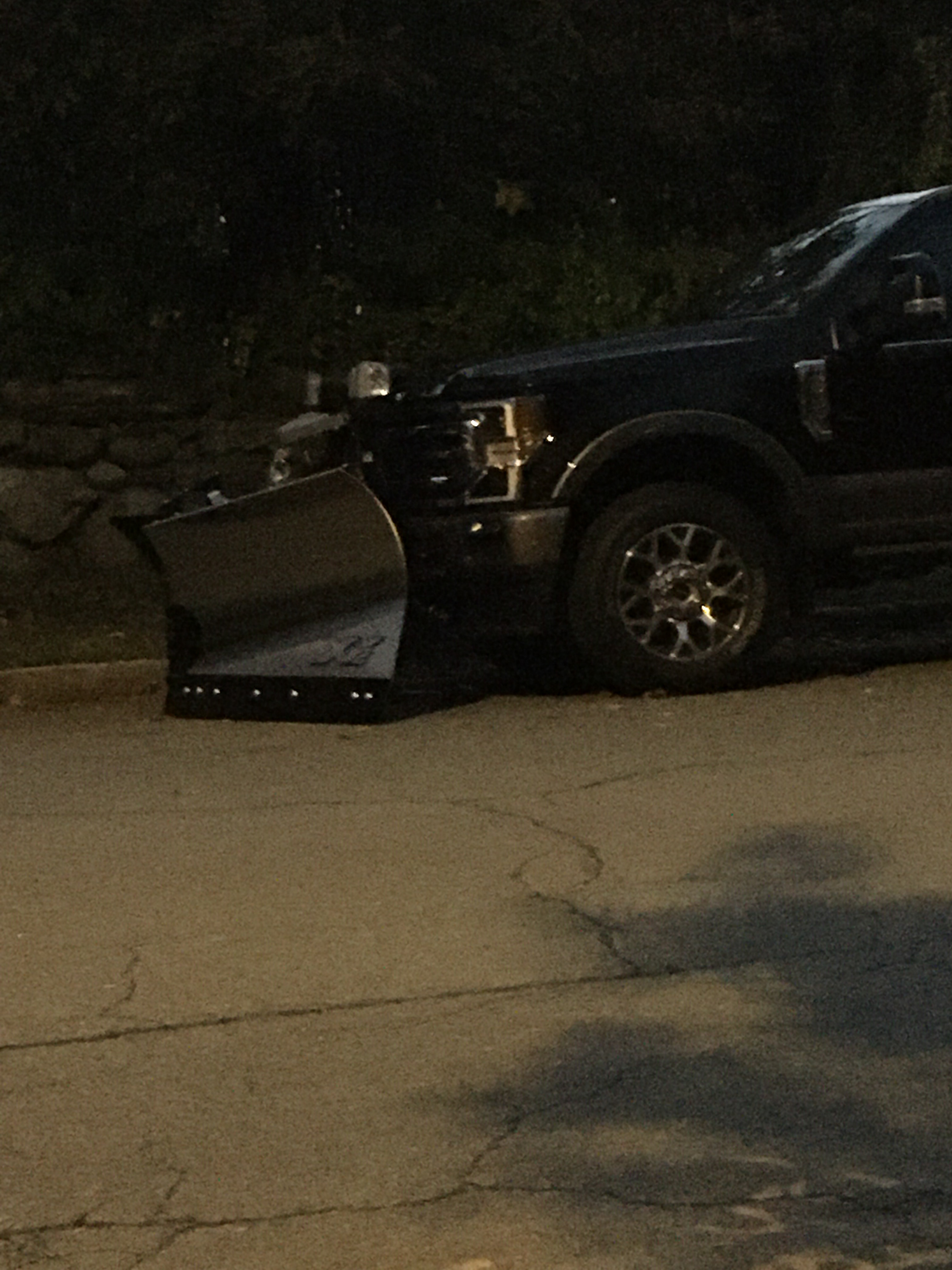a truck with a v shaped snowplow on the front