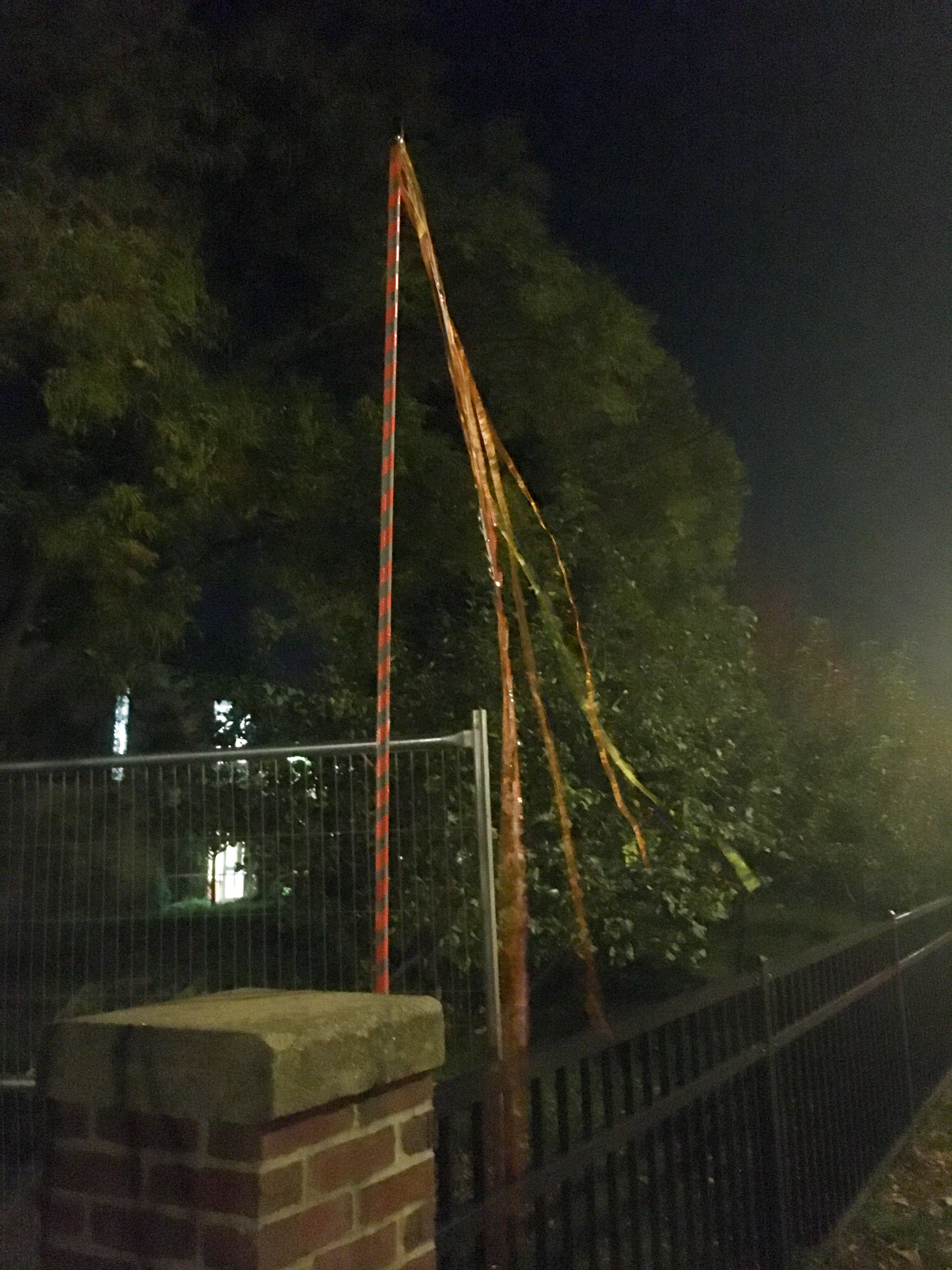 striped pole with streamers