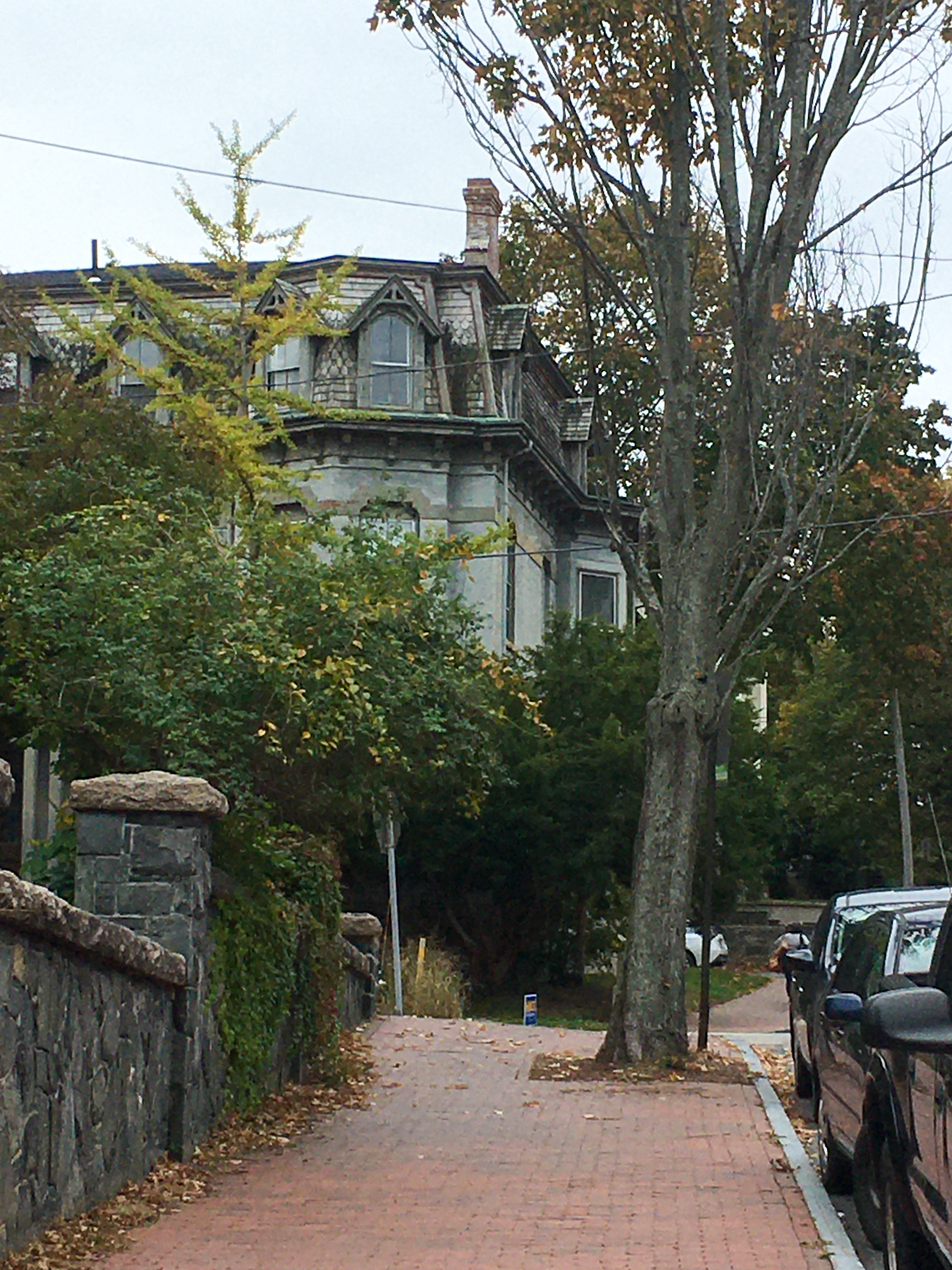 large gray brick victorian house