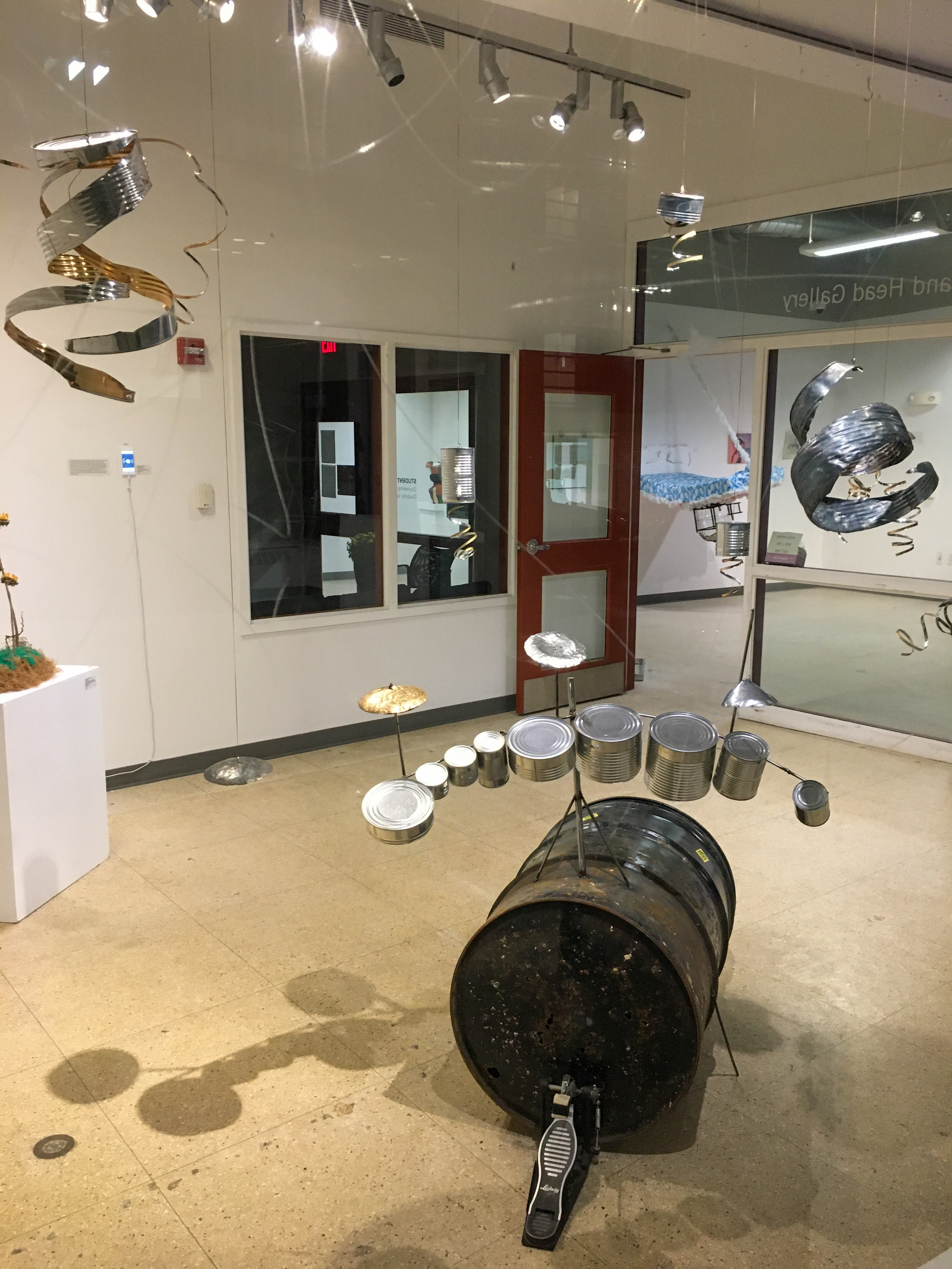 drum set made out of cans at the art school