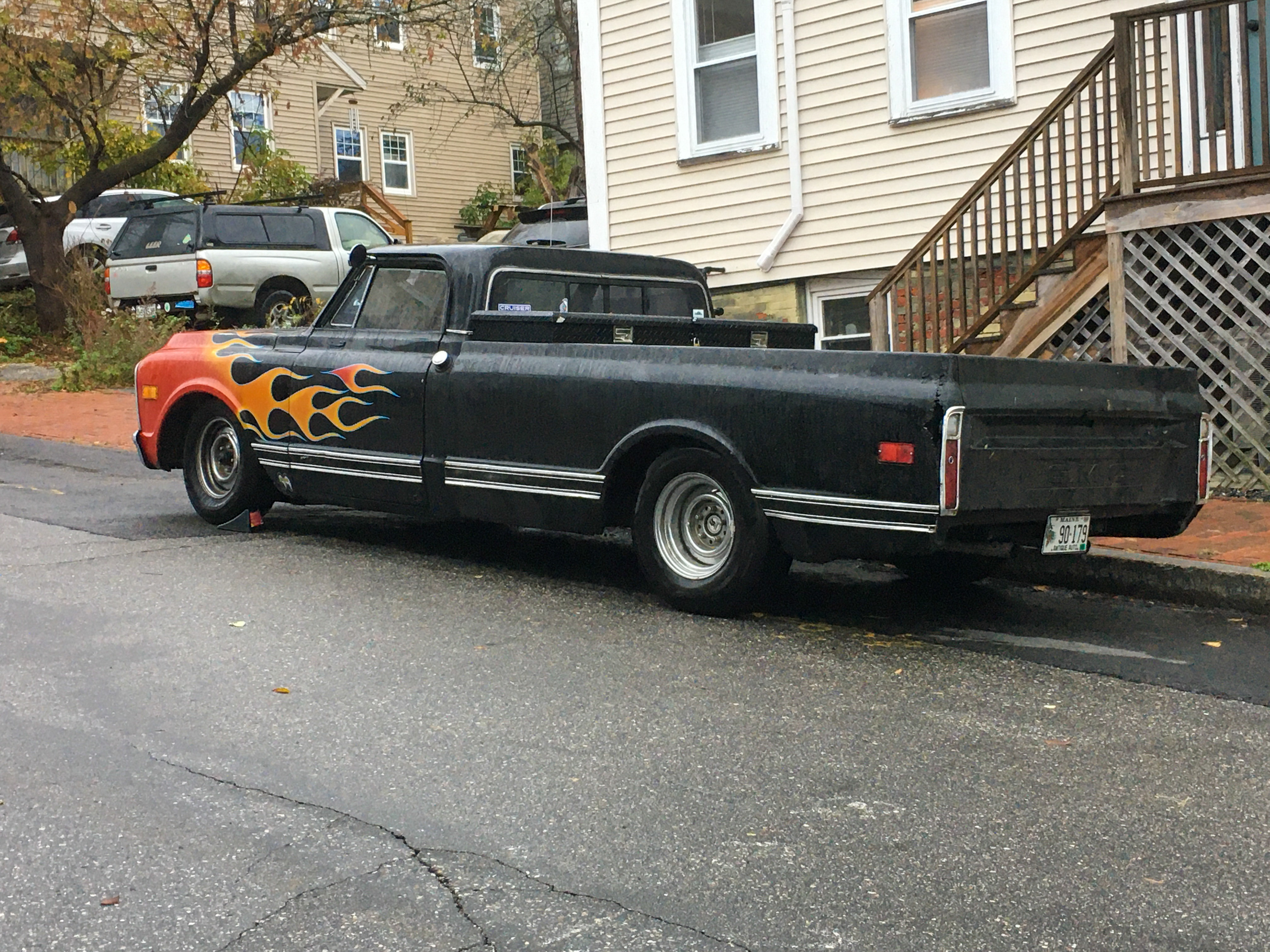 black truck with orange flames on the front