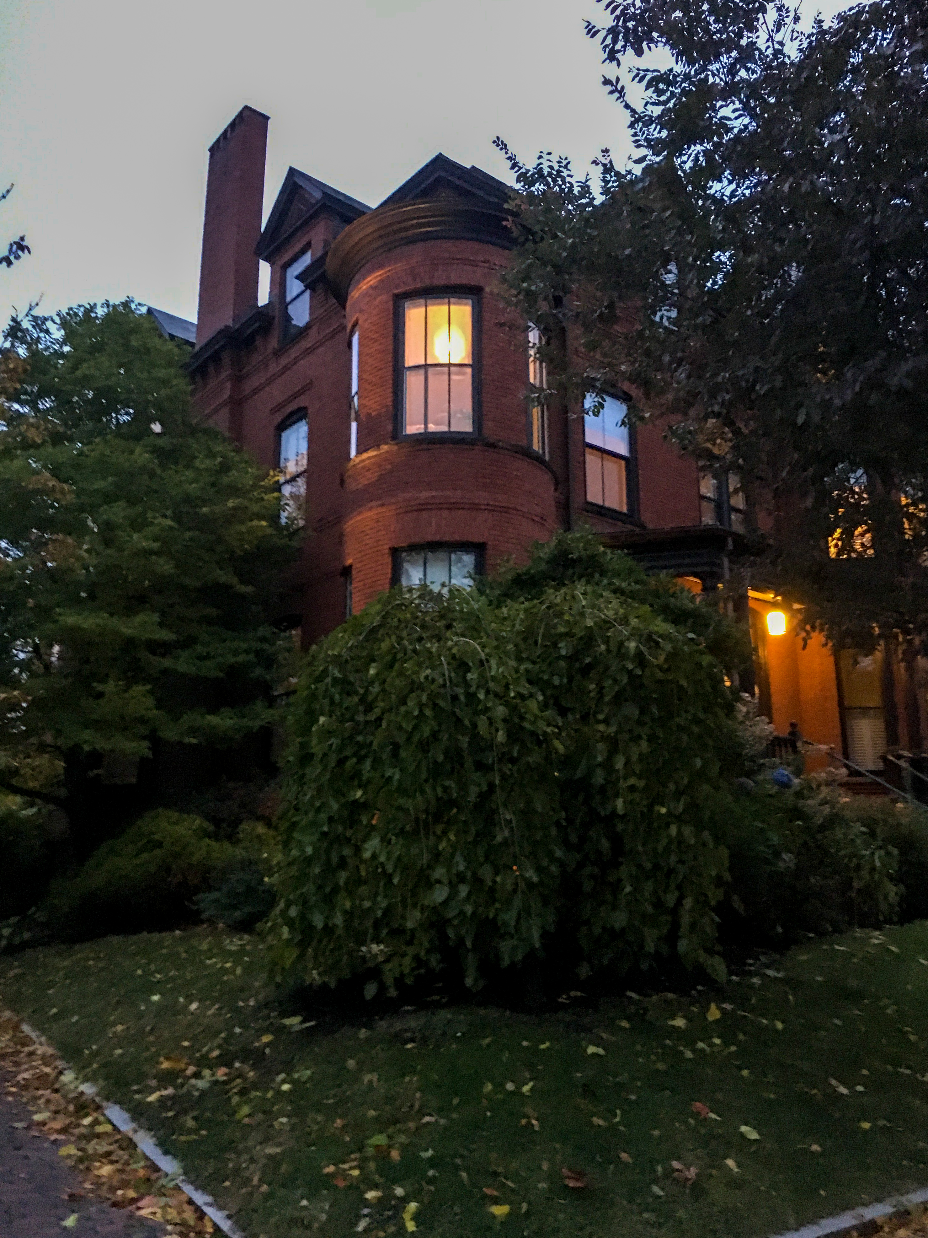 brick house with lights in the window