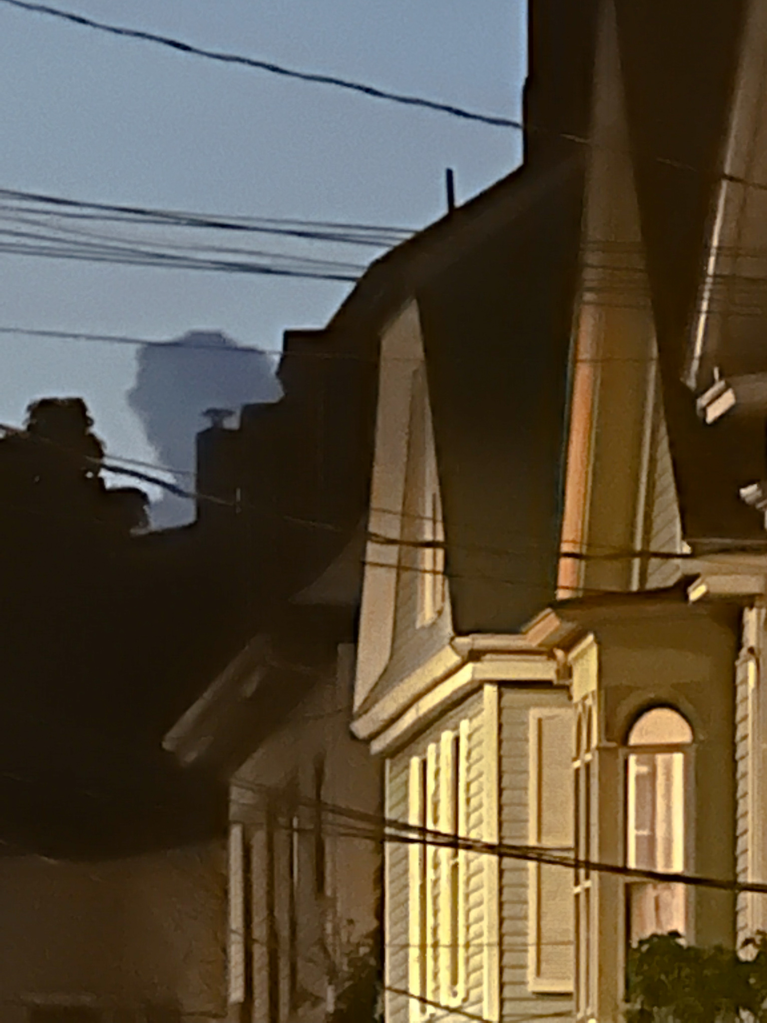 dramatic clouds behind yellow highlighted houses