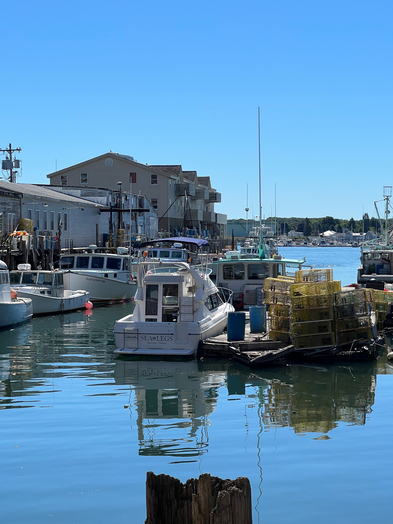 dock with boats and reflection in the water