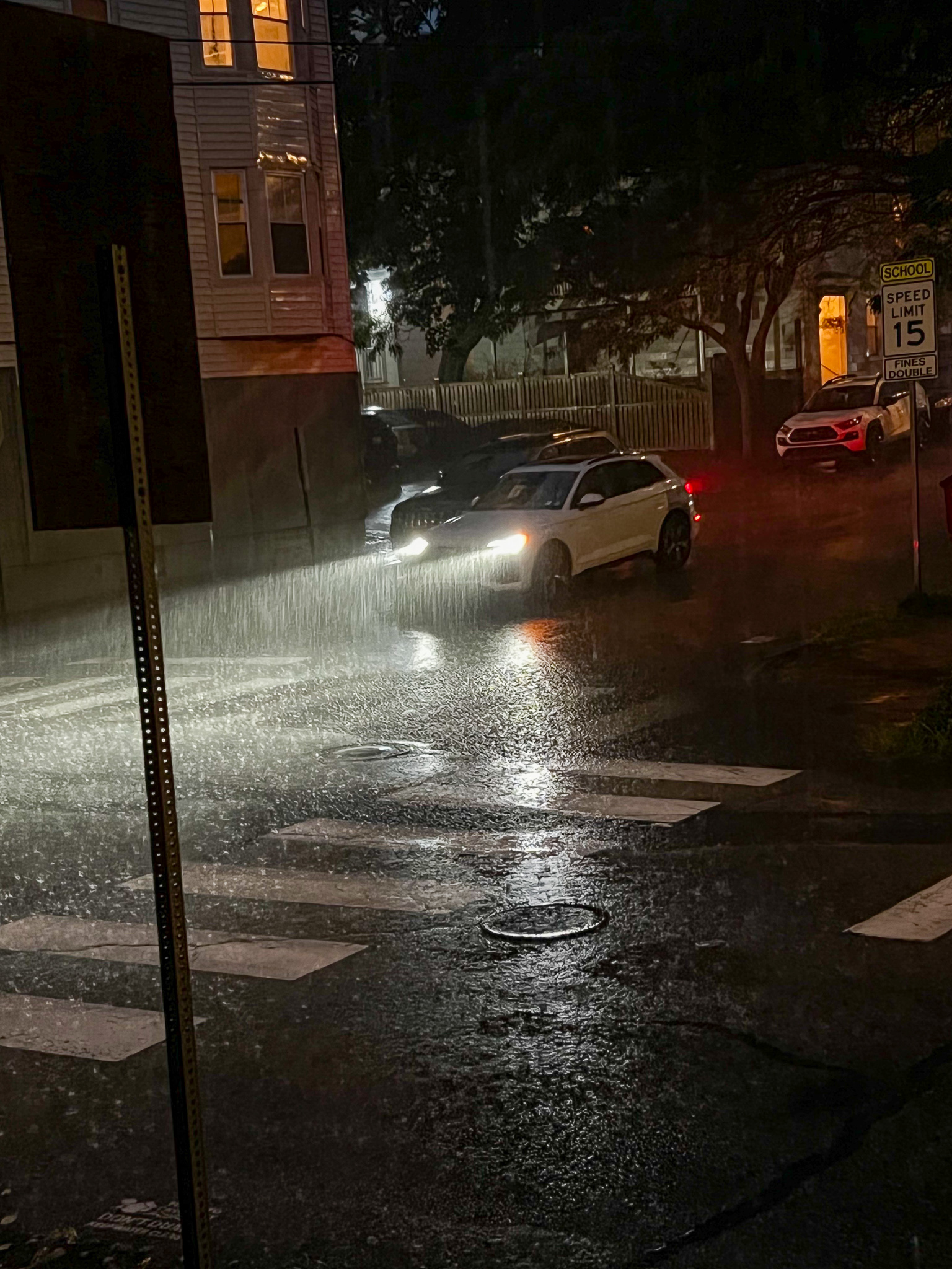 rain in the headlights of a car at night