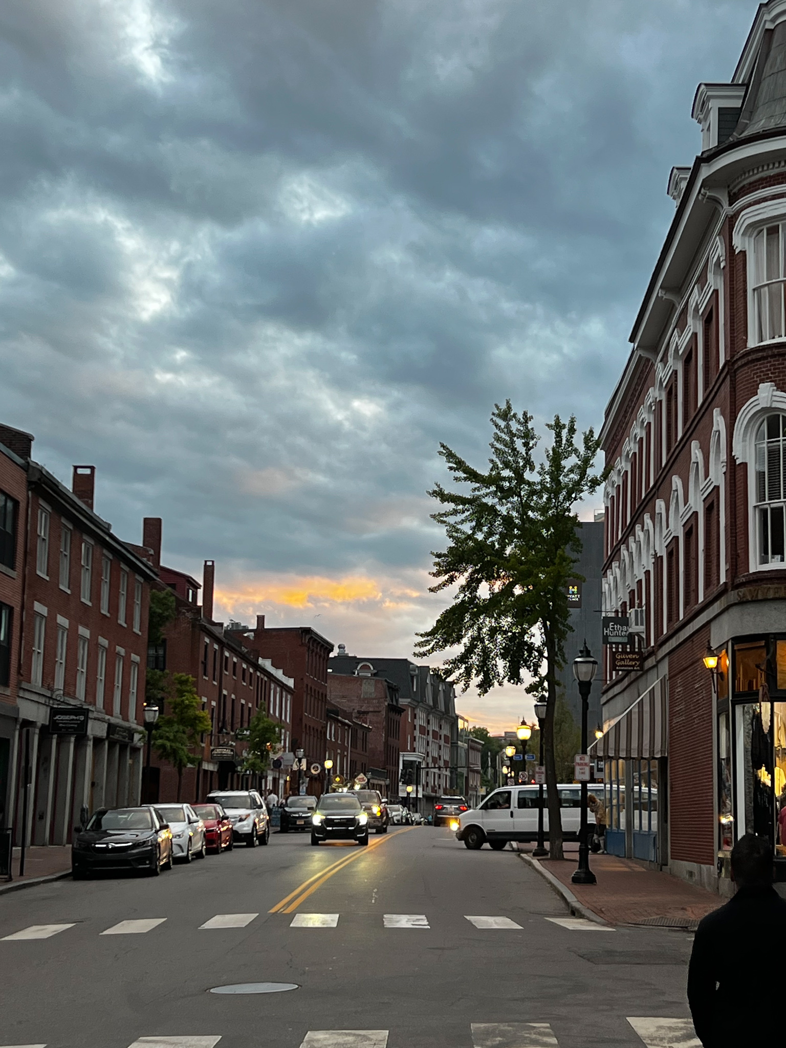 looking up Fore street with great clouds and brick buildings