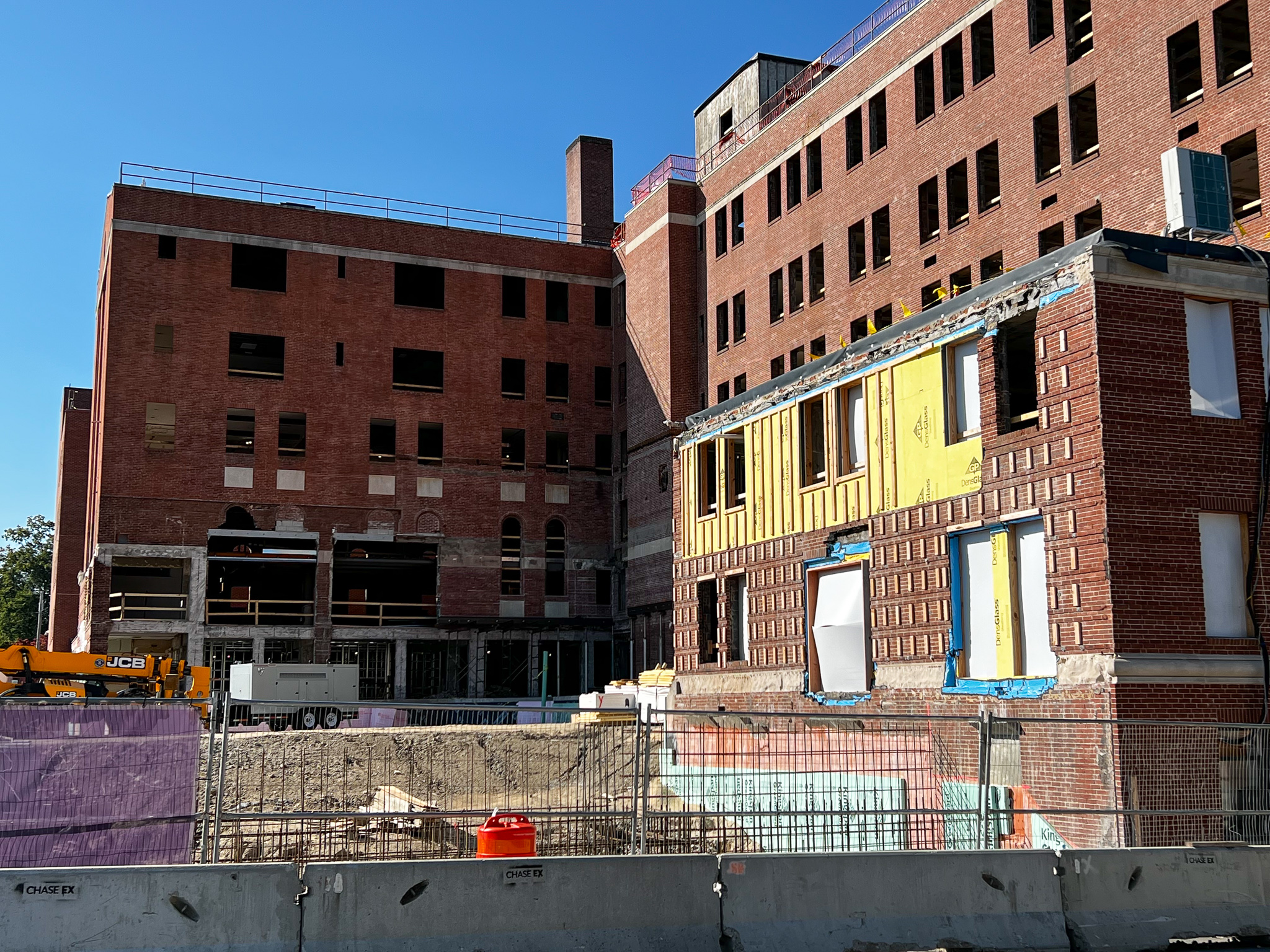 Large brick building in the process of demolition