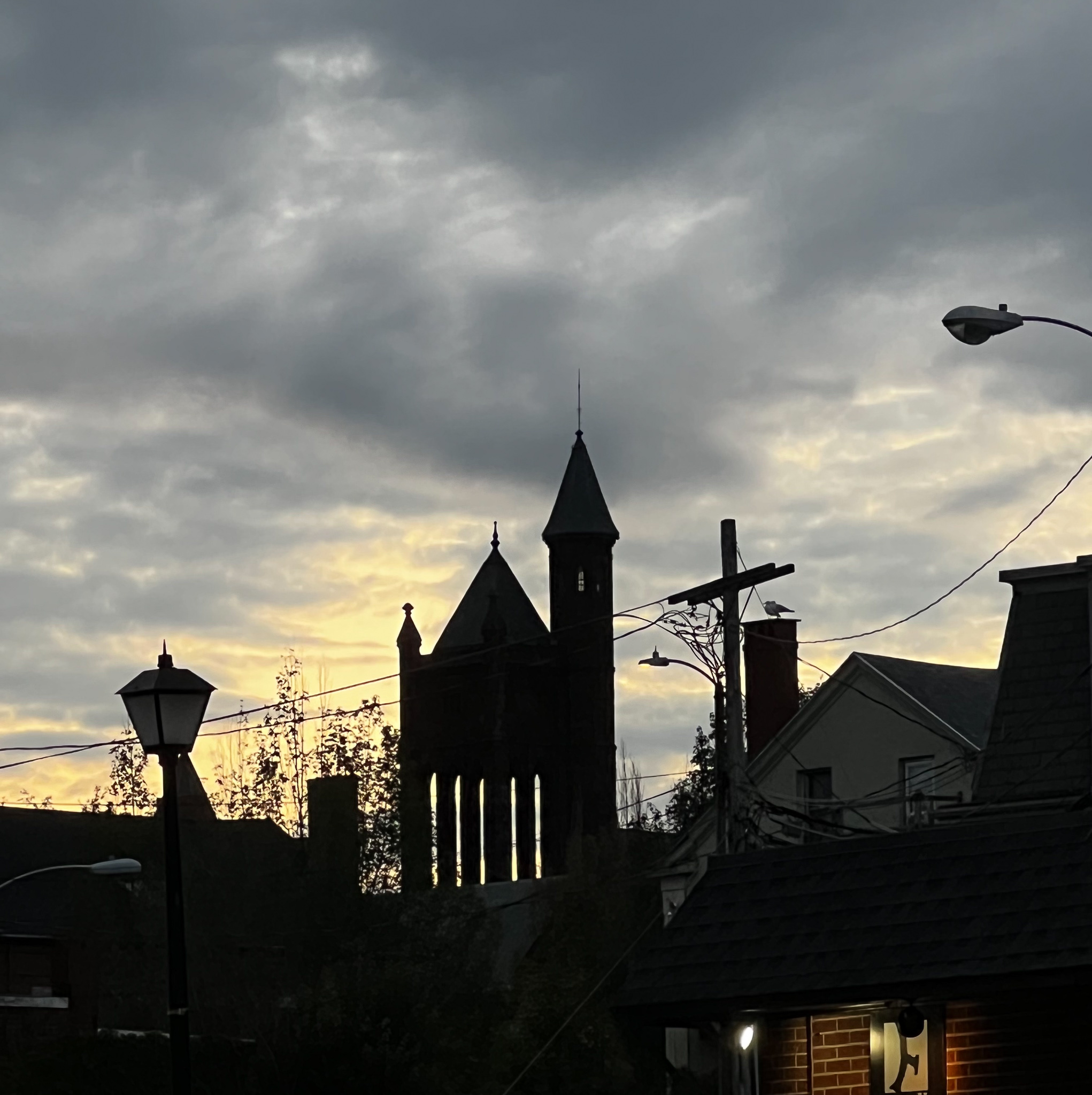 church with see through elements against a light cloudy sky