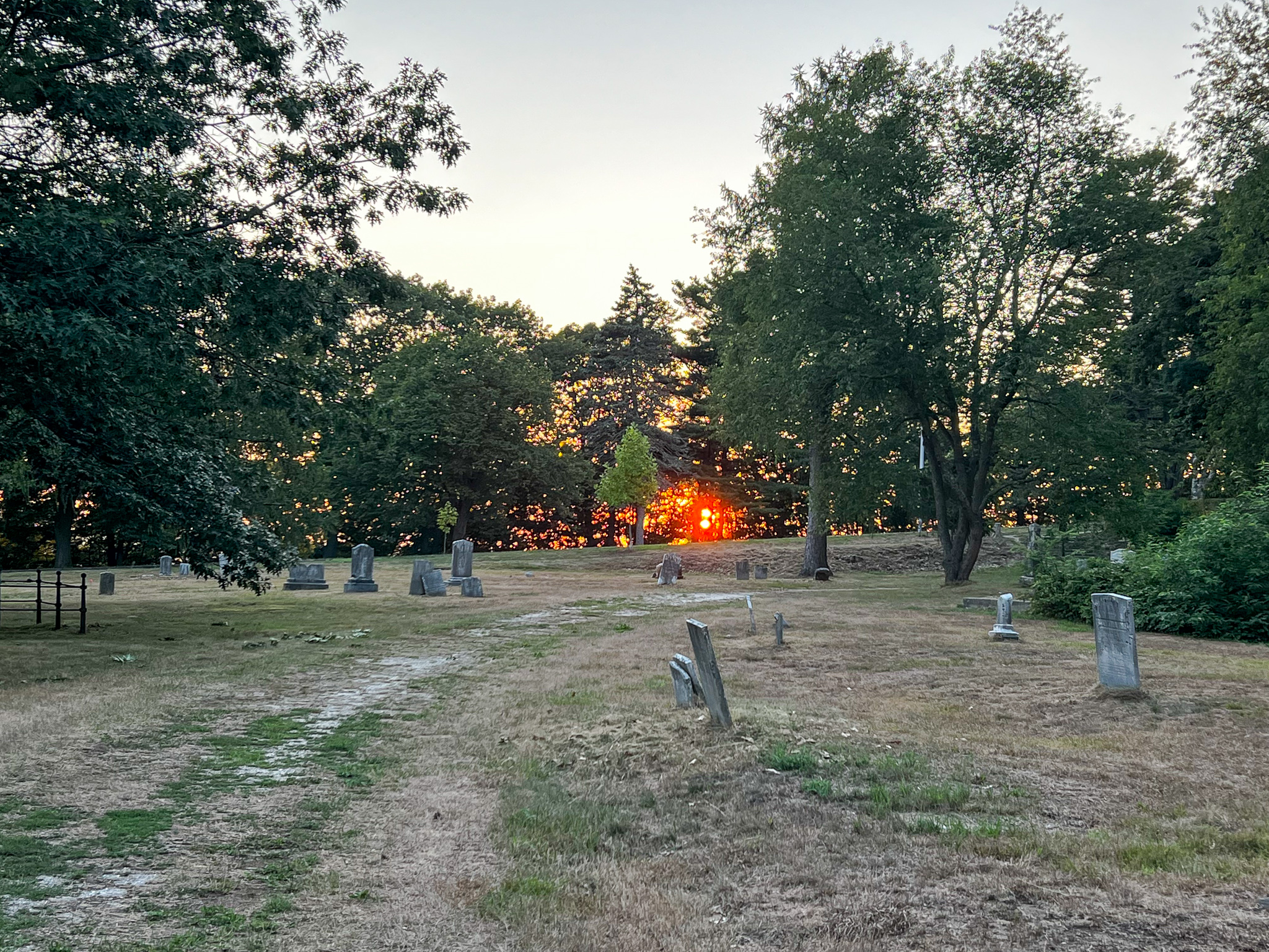 cemetery with a red sunset