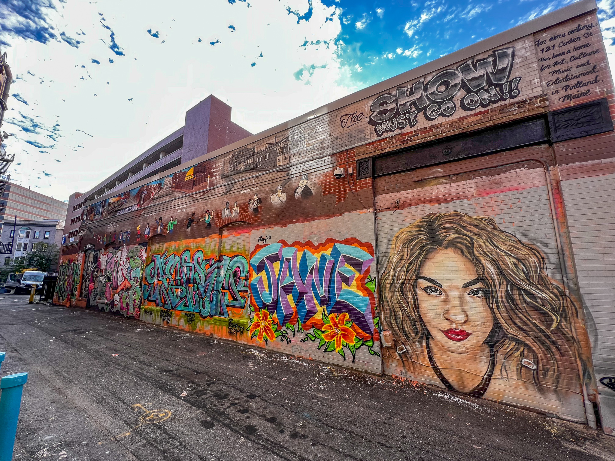 an alley with a mural