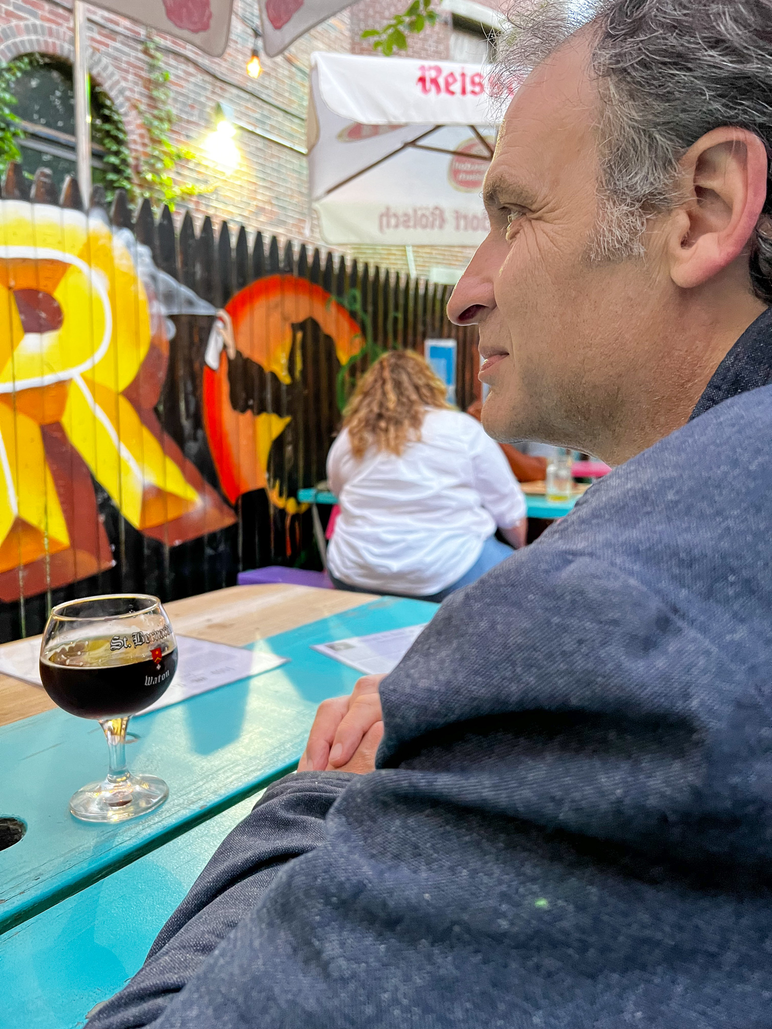 Man's profile at a restaurant with graffiti