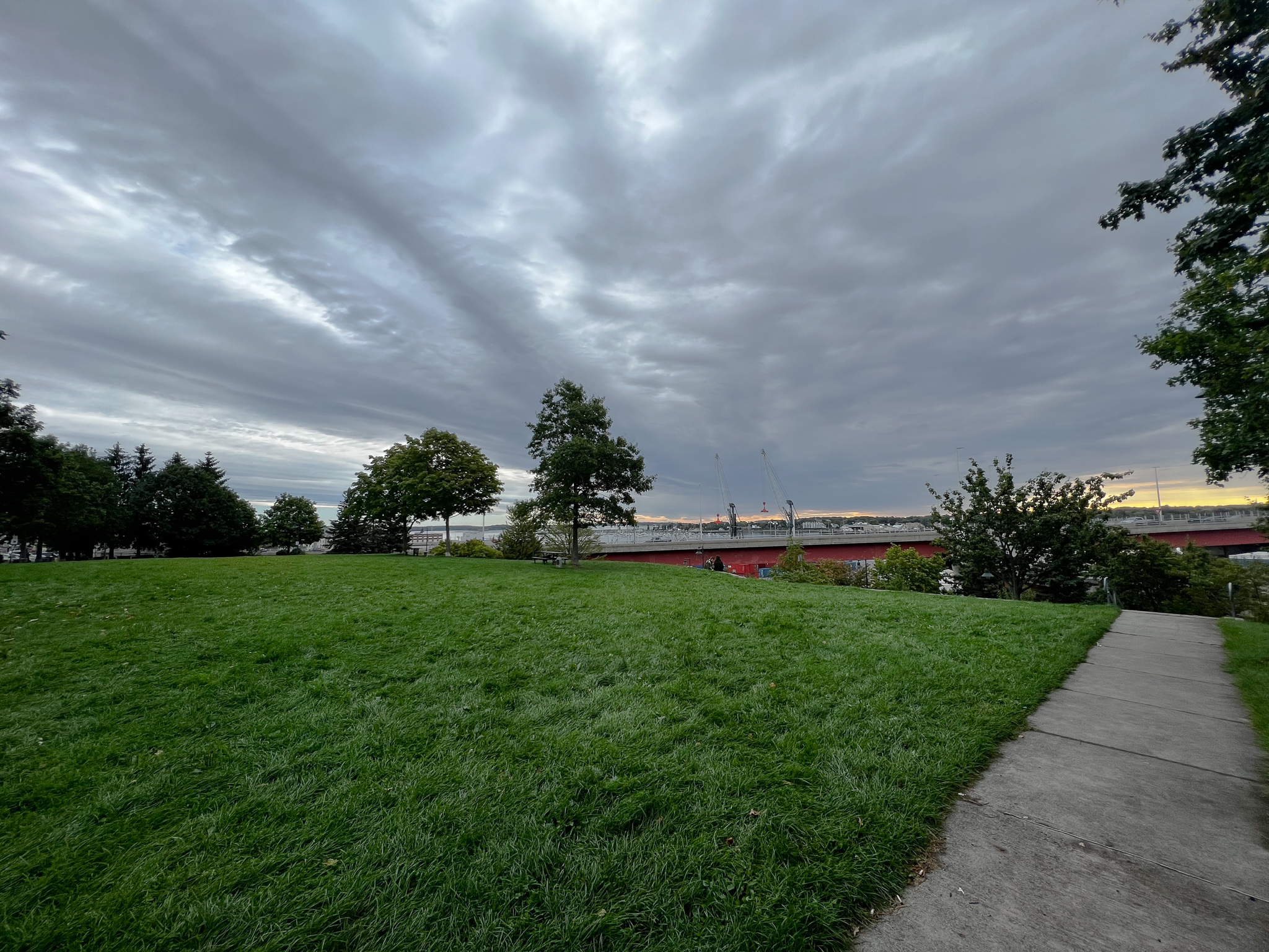 clouds over a grassy field