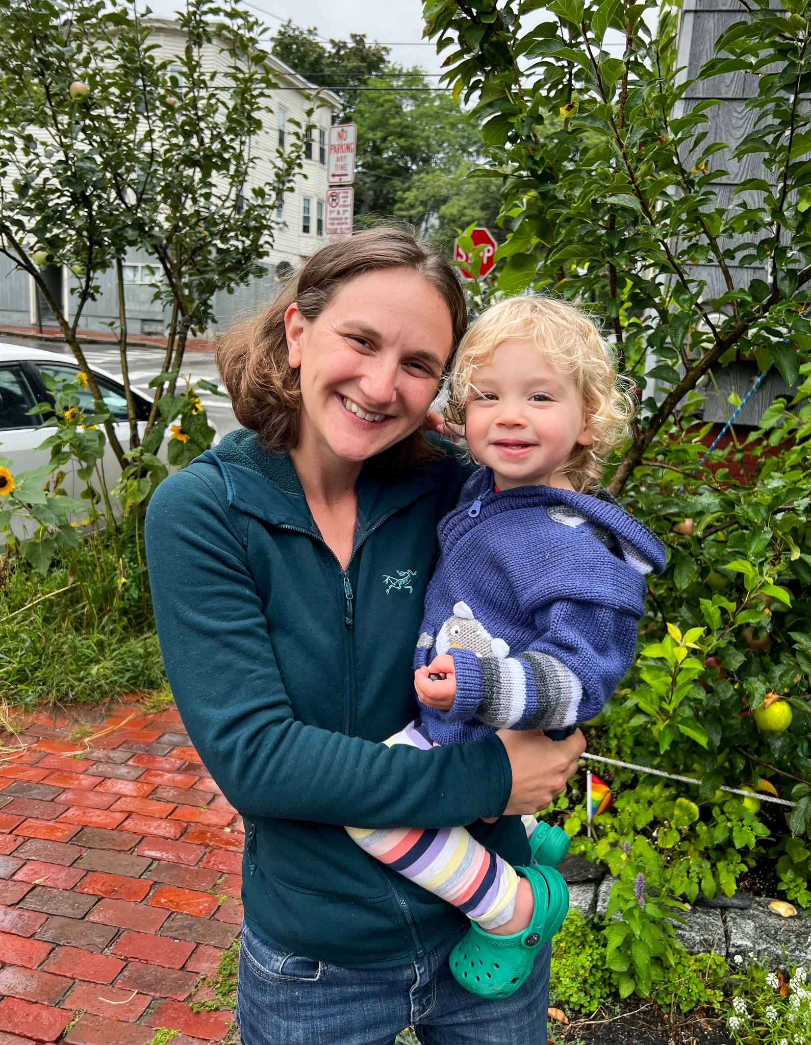 Woman holding a cute child smiling