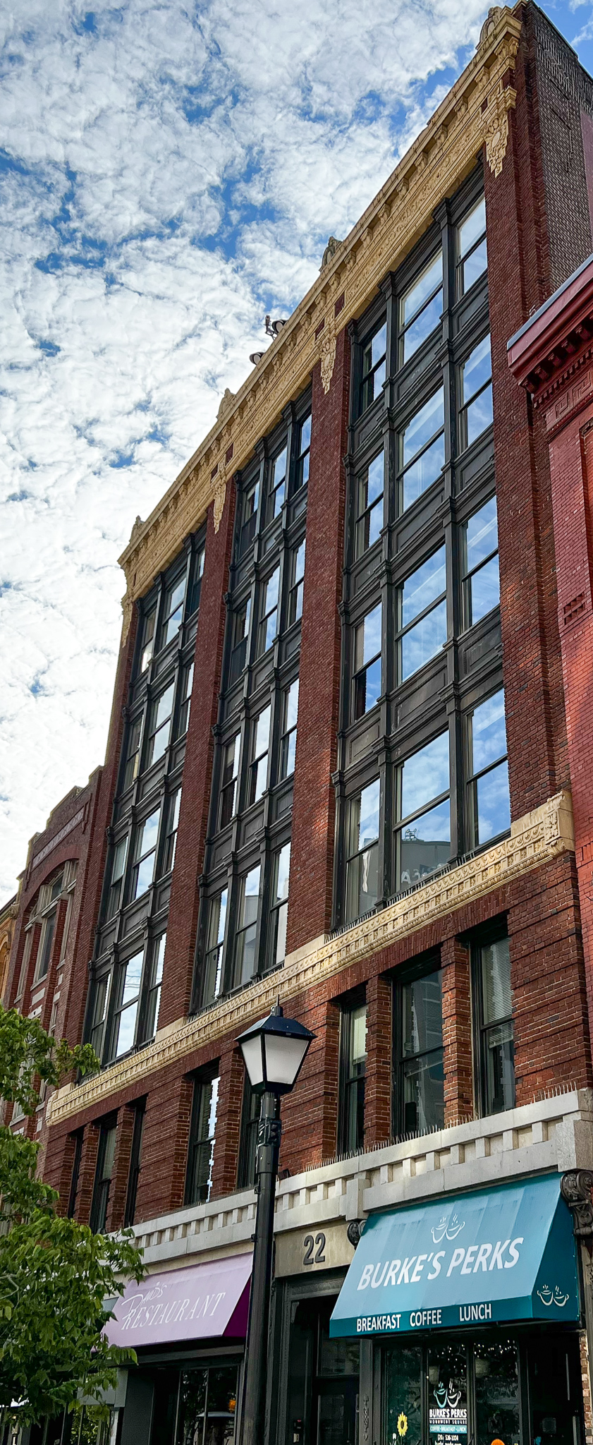 front of the old brick building cleaned up with lots of windows