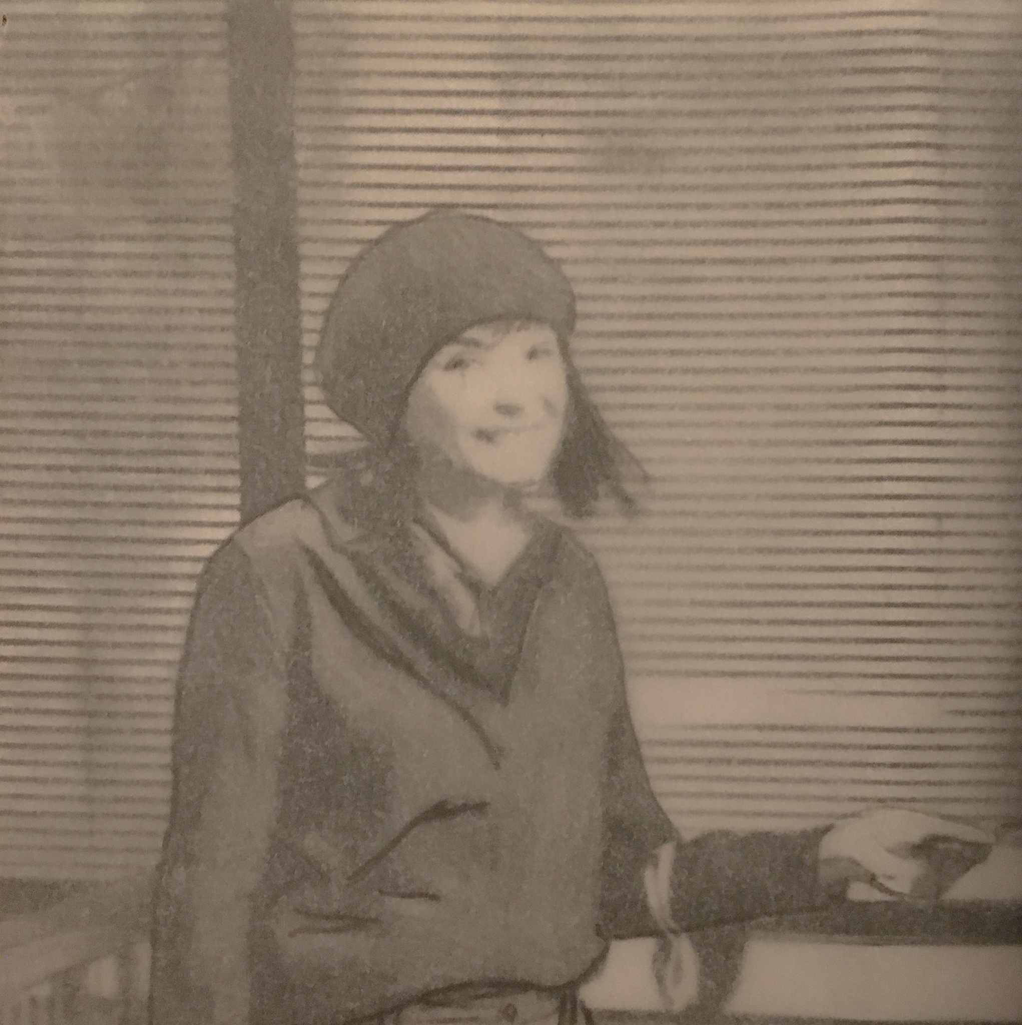 picture of a woman smiling wearing a hat