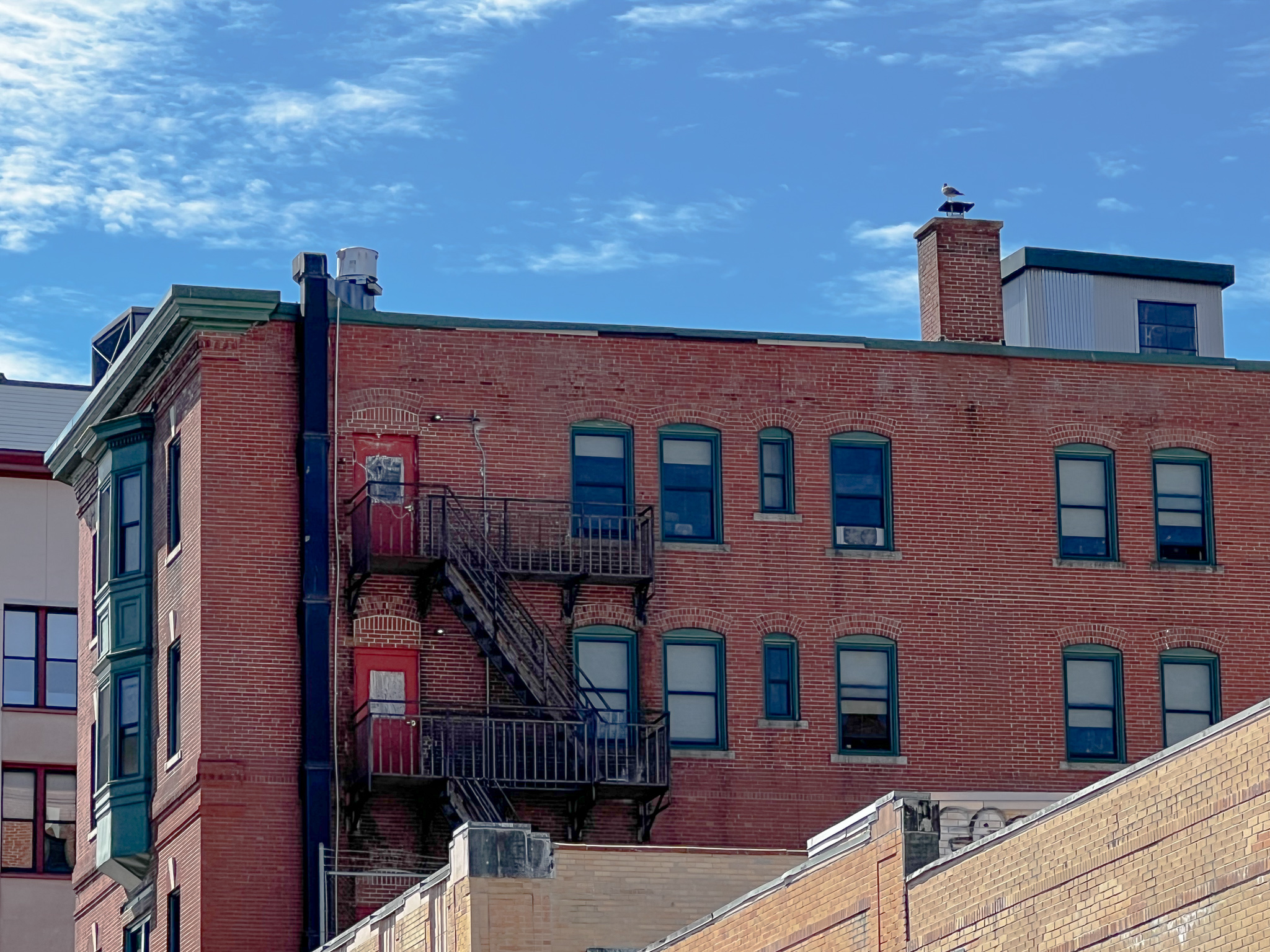 brick building against a blue sky