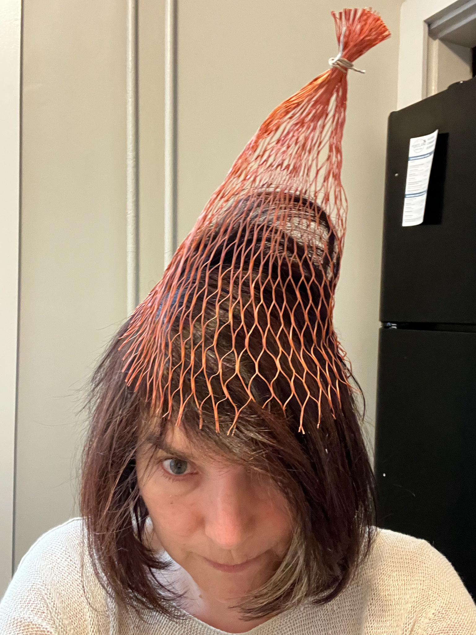 woman with an oyster bag on her head