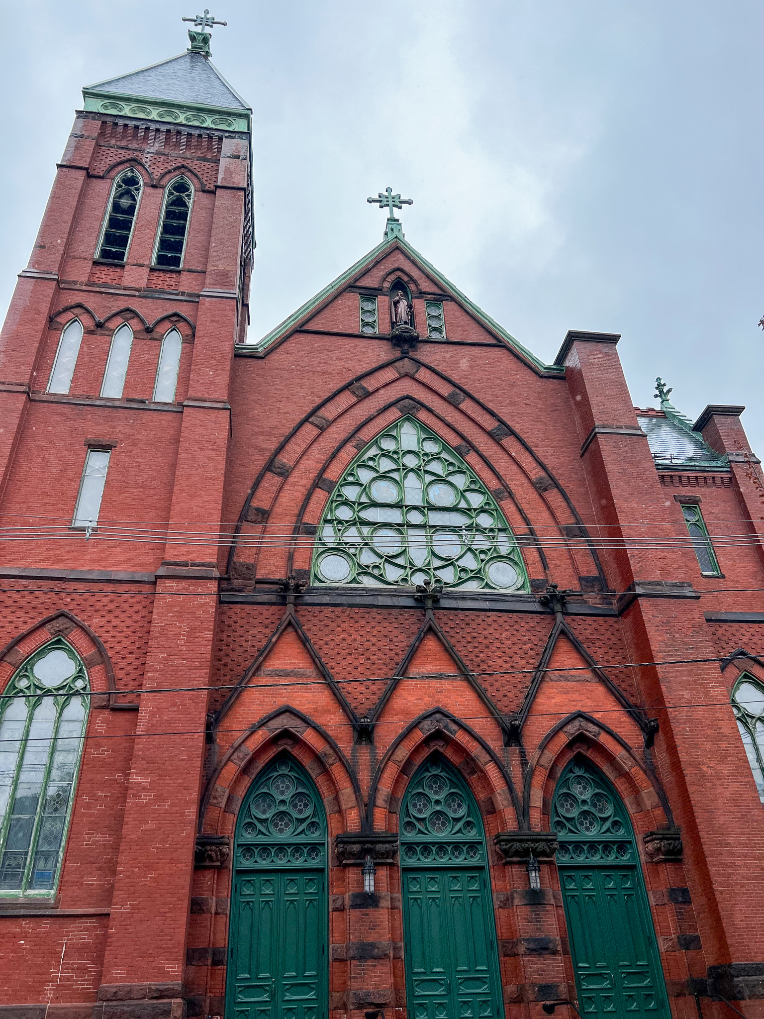 beautiful front of a catholic church made of brick