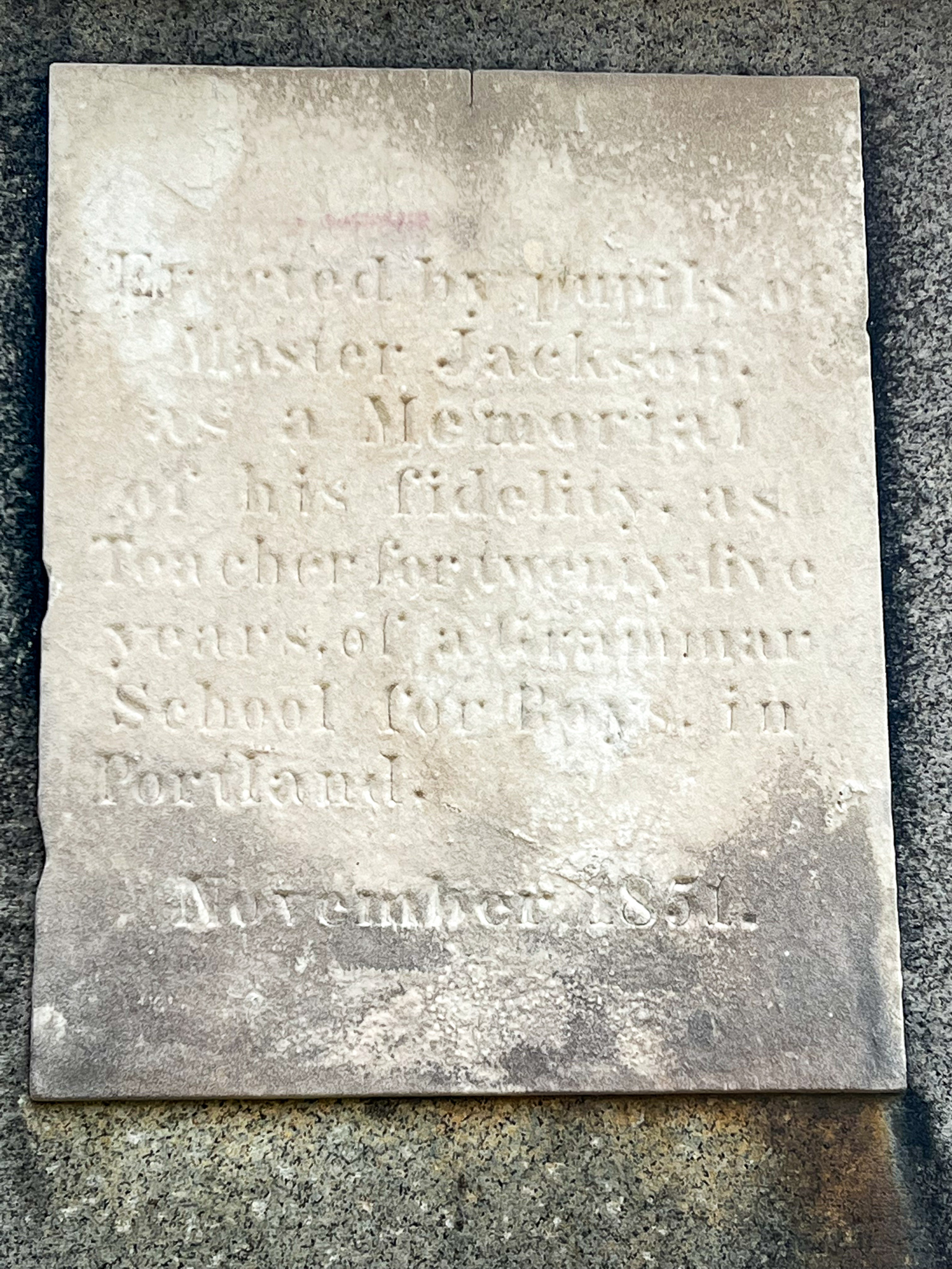 marble plack with writing on it