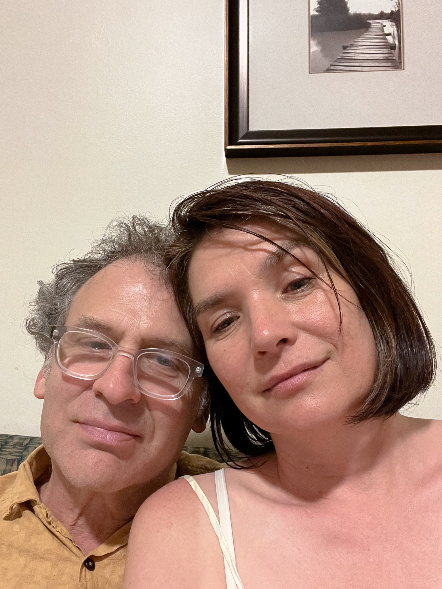 a man and a woman with their heads together